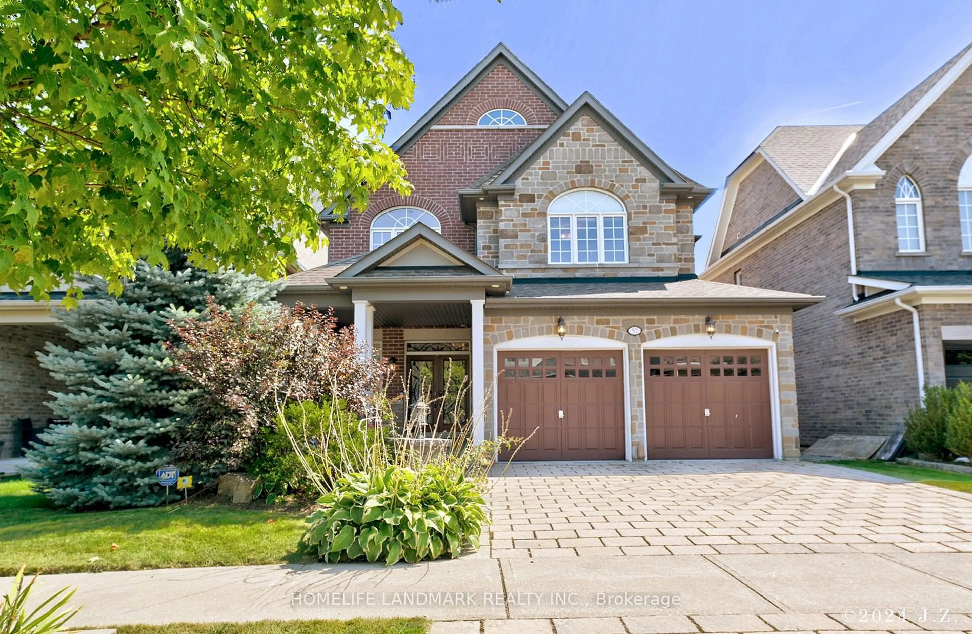 Home with brick exterior material, street for 57 Castleglen Blvd, Markham Ontario L6C 0A9