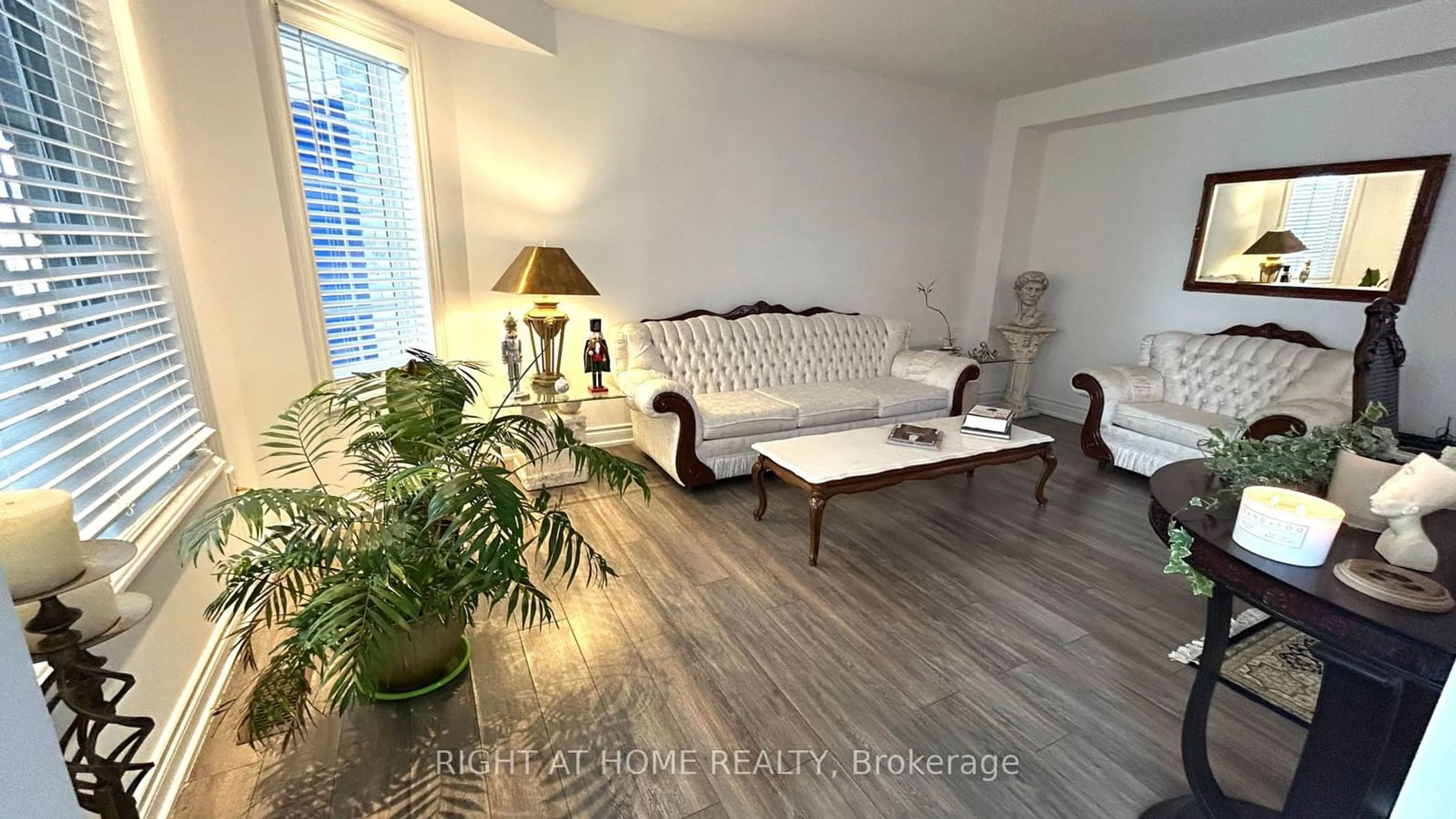 Living room with furniture, wood/laminate floor for 2072 Wilson St, Innisfil Ontario L9S 4Y2