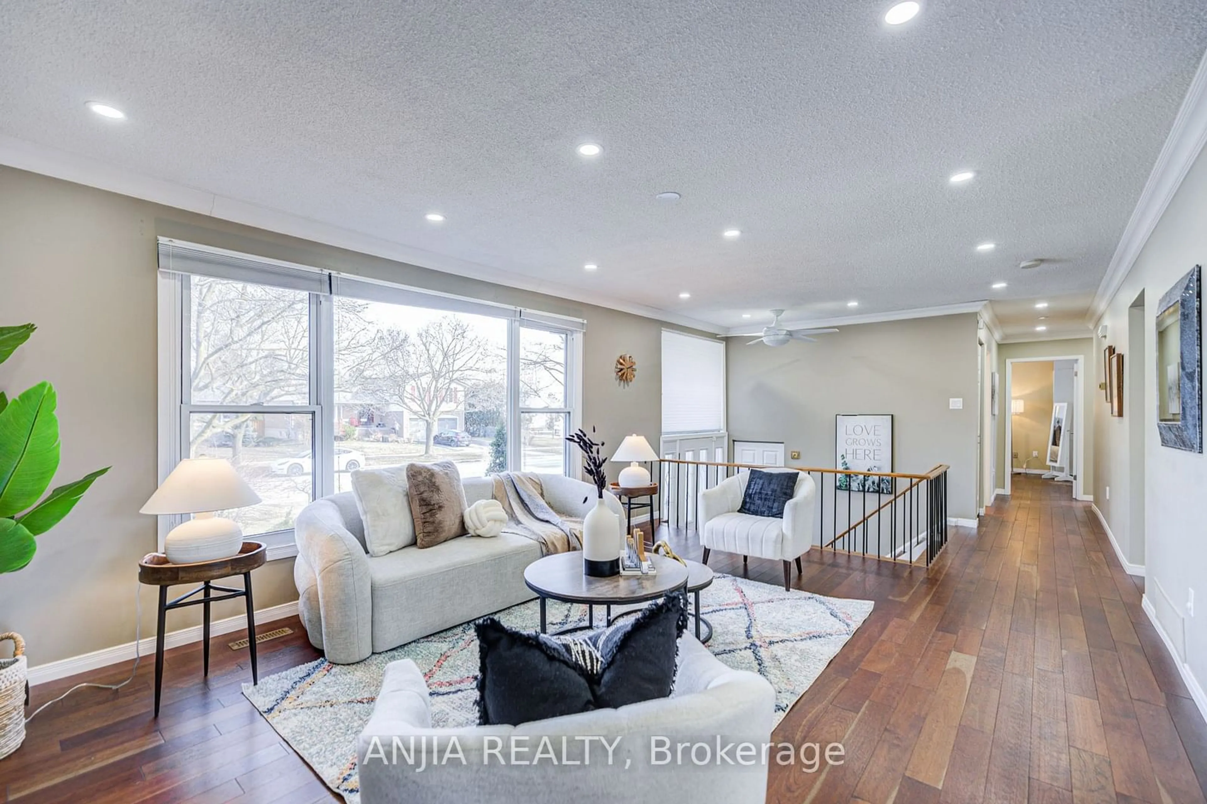 Living room with furniture, wood/laminate floor for 82 Wootten Way, Markham Ontario L3P 2Y8