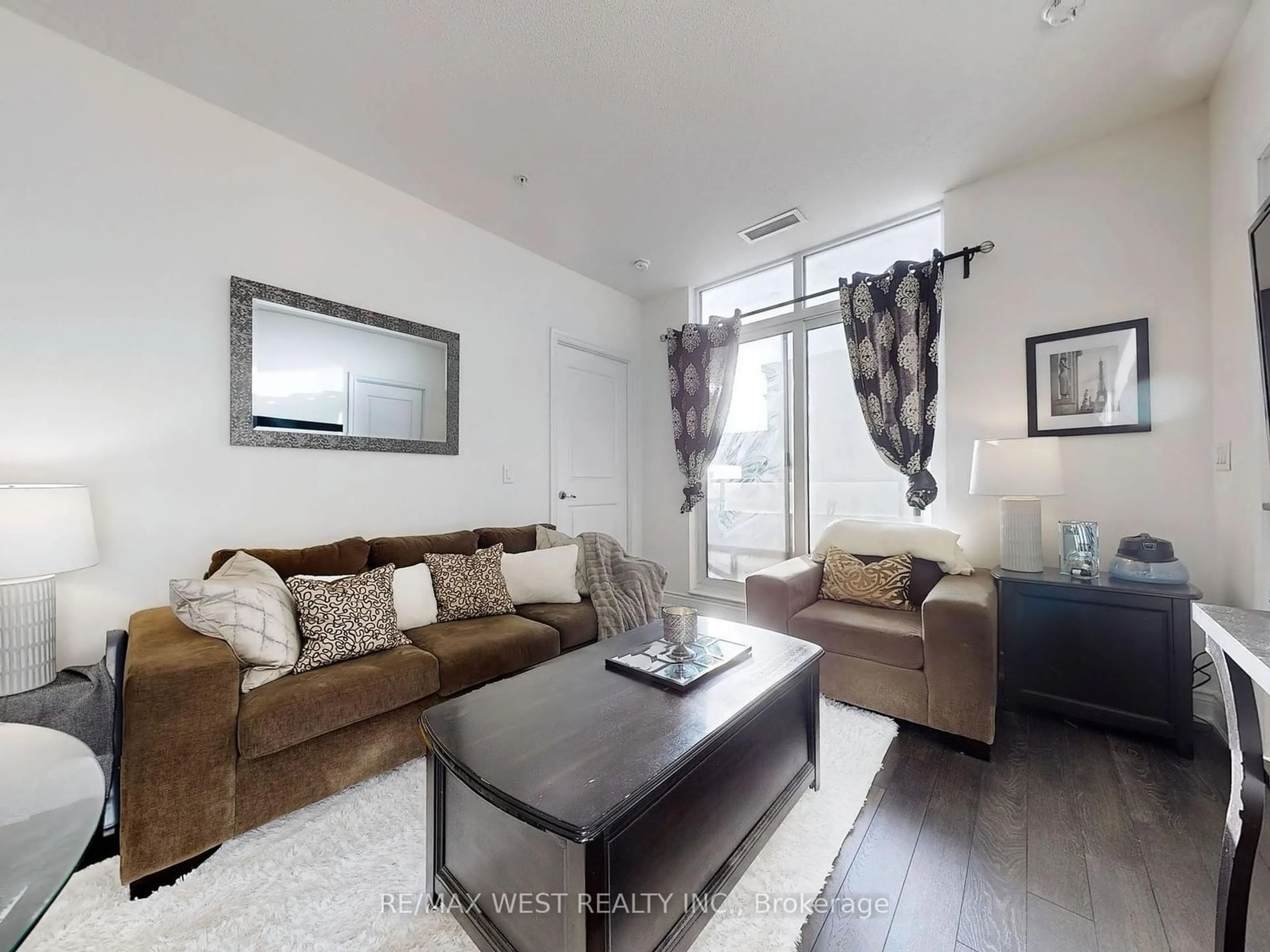 Living room with furniture, wood/laminate floor for 9255 Jane St #1716, Vaughan Ontario L6A 0K1