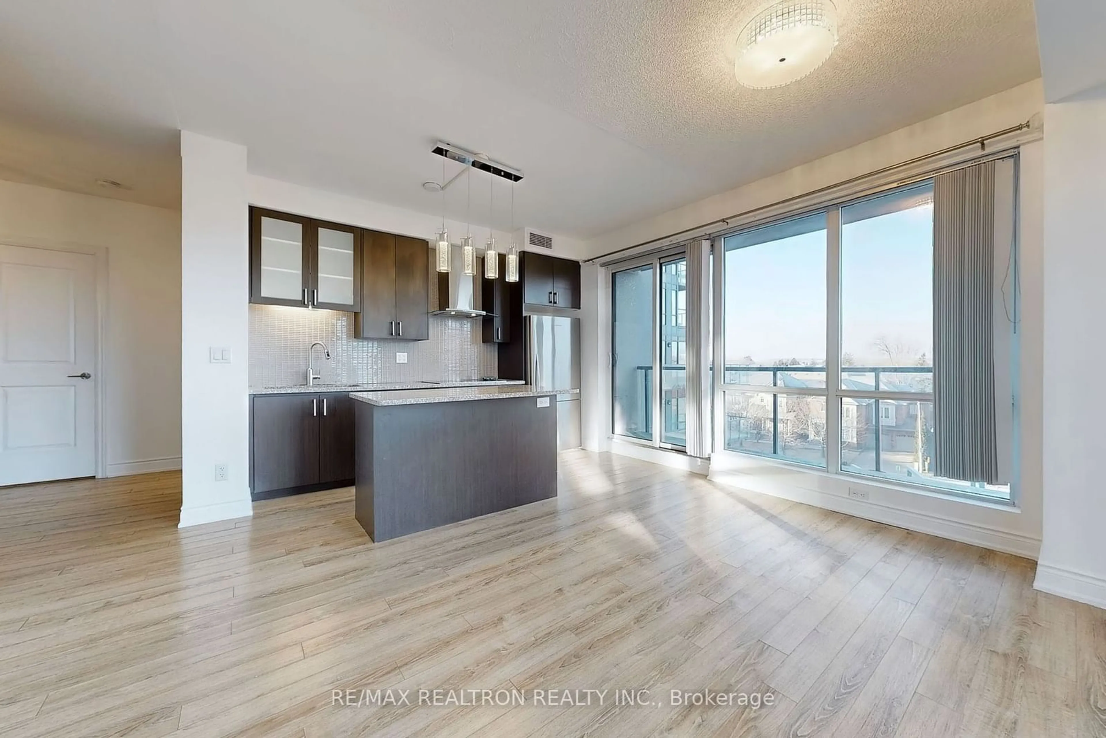 Open concept kitchen, wood/laminate floor for 9088 Yonge St #302A, Richmond Hill Ontario L4C 0Y6