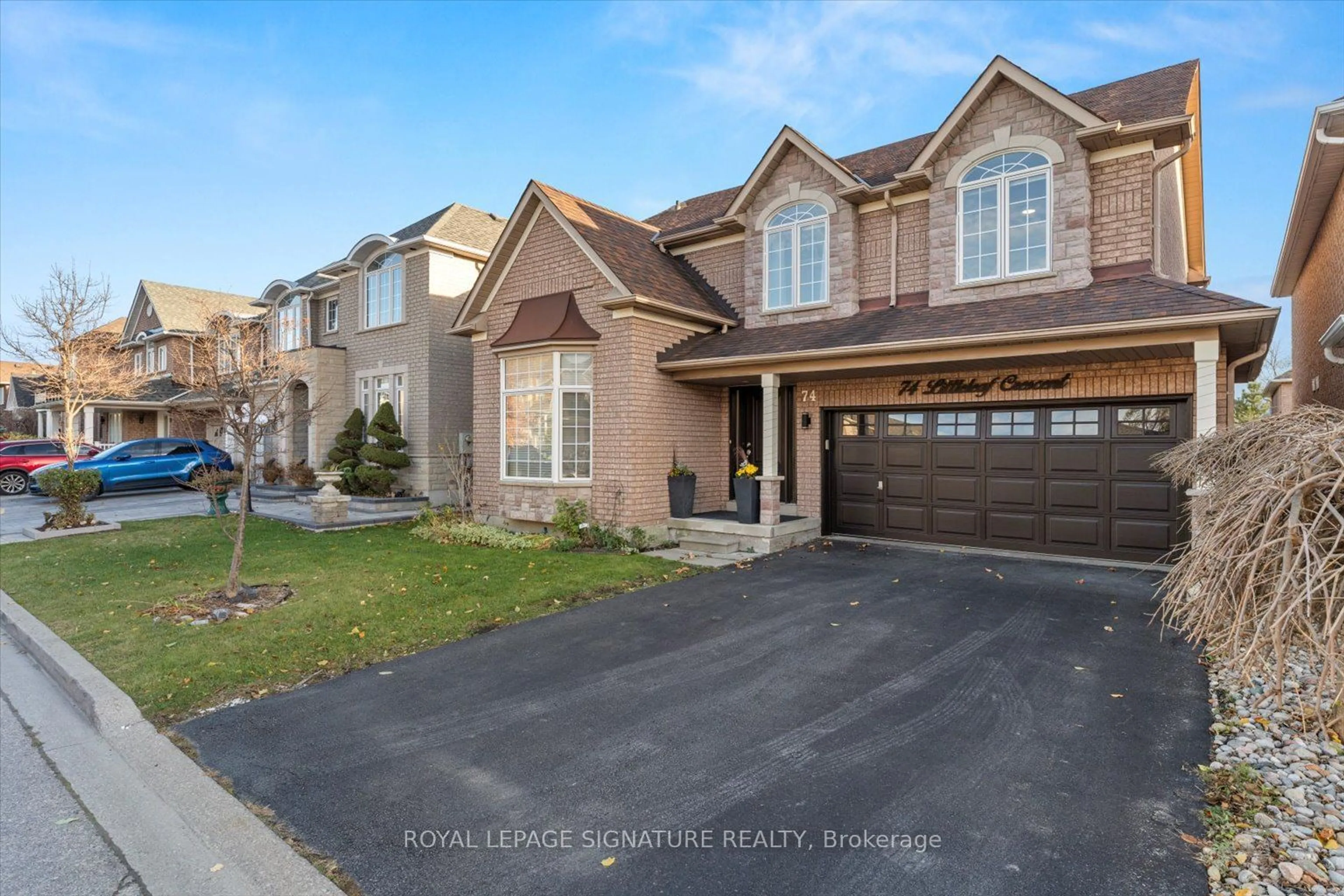 Home with brick exterior material, street for 74 Littleleaf Cres, Markham Ontario L3S 4G1