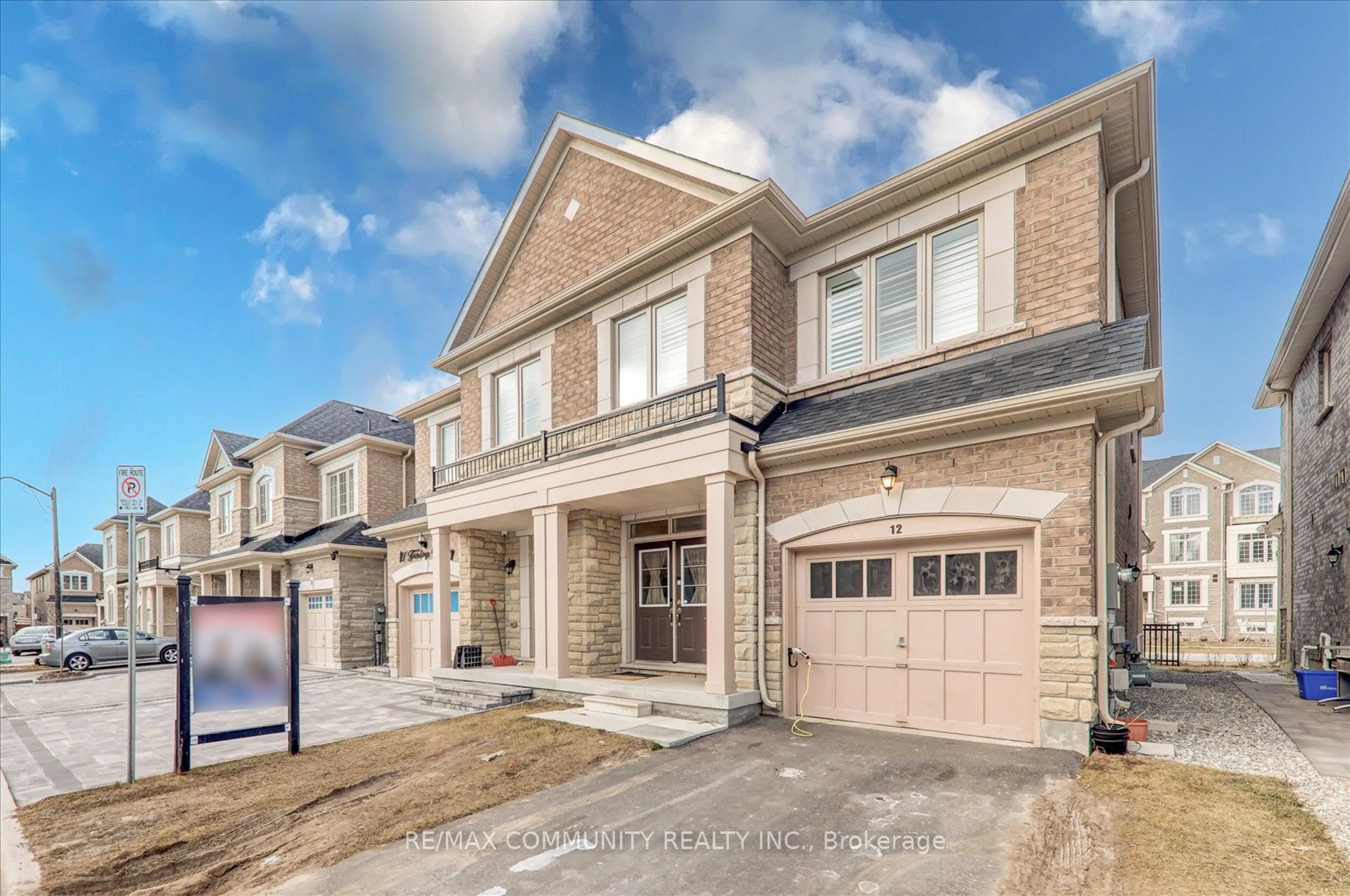 Home with brick exterior material, street for 12 Finley Way, Markham Ontario L3S 0E8