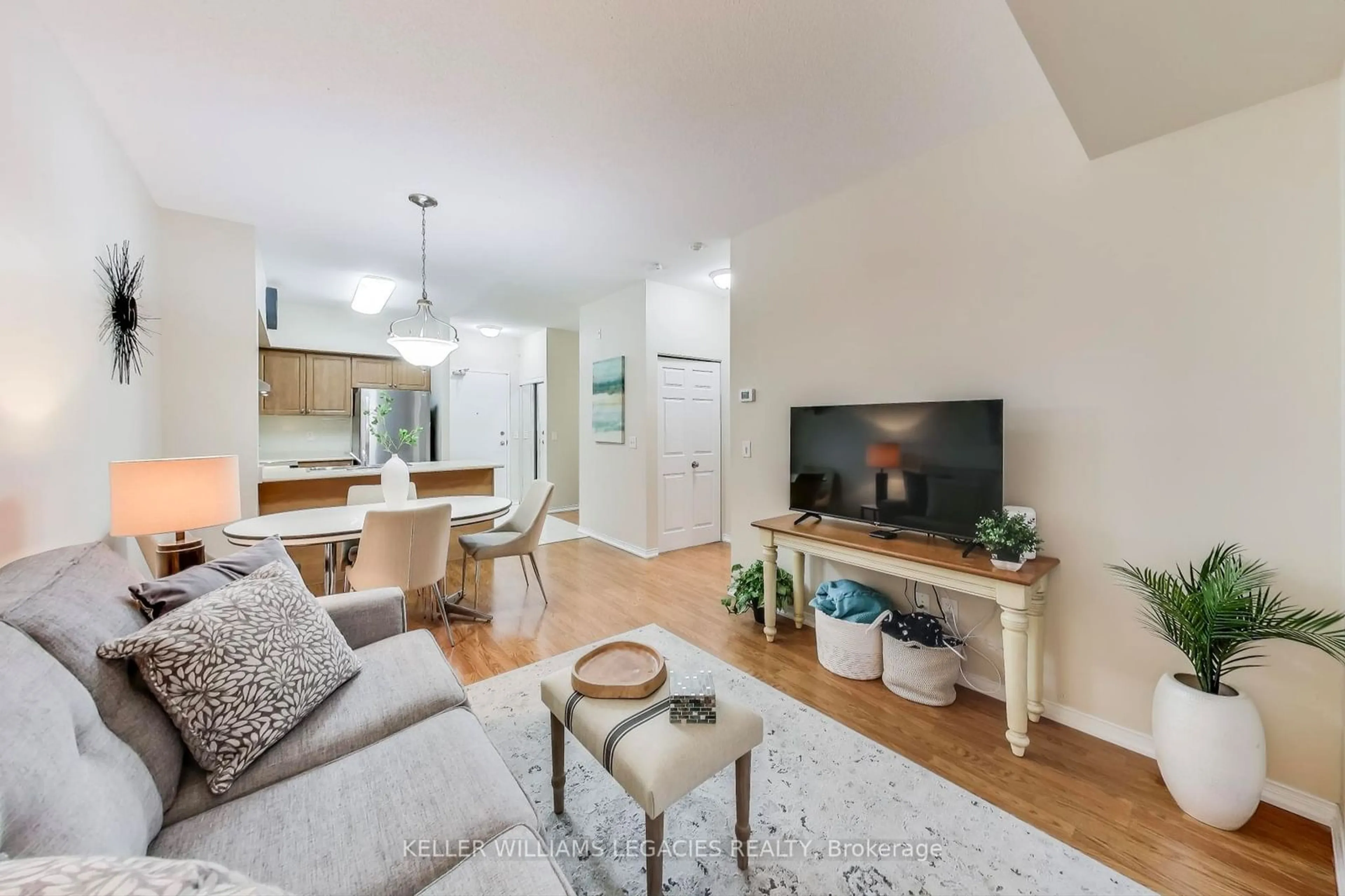 Living room with furniture, wood/laminate floor for 9973 Keele St #101, Vaughan Ontario L6A 3Y5