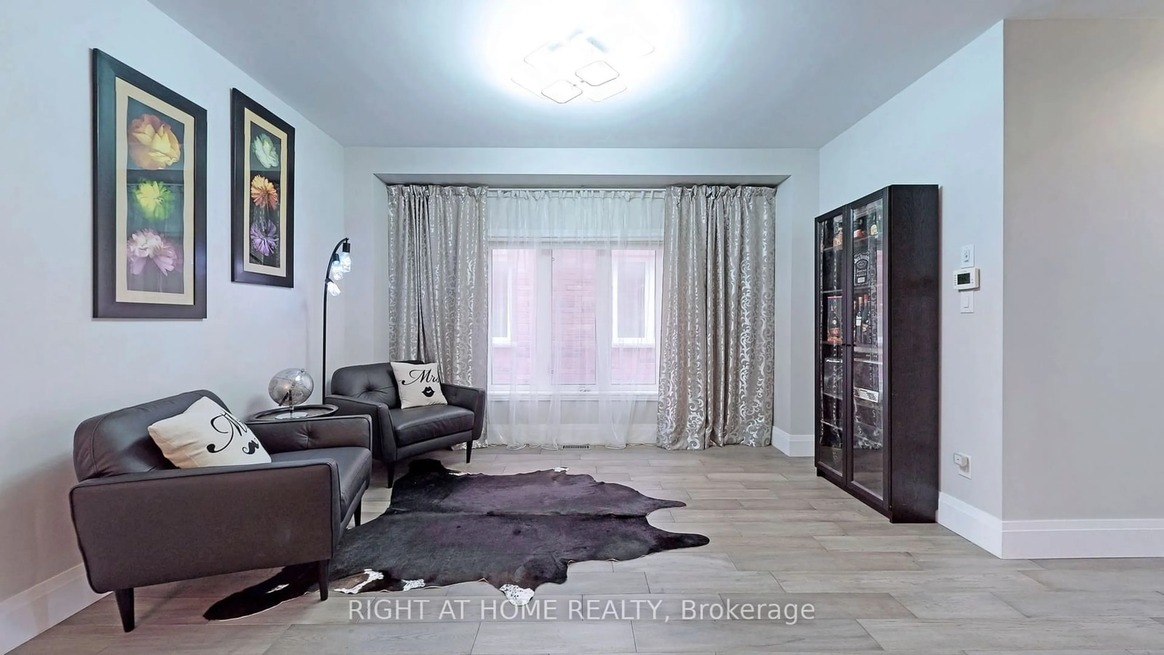 Living room with furniture, wood/laminate floor for 20 Ironbark Crt, Vaughan Ontario L6A 4S6