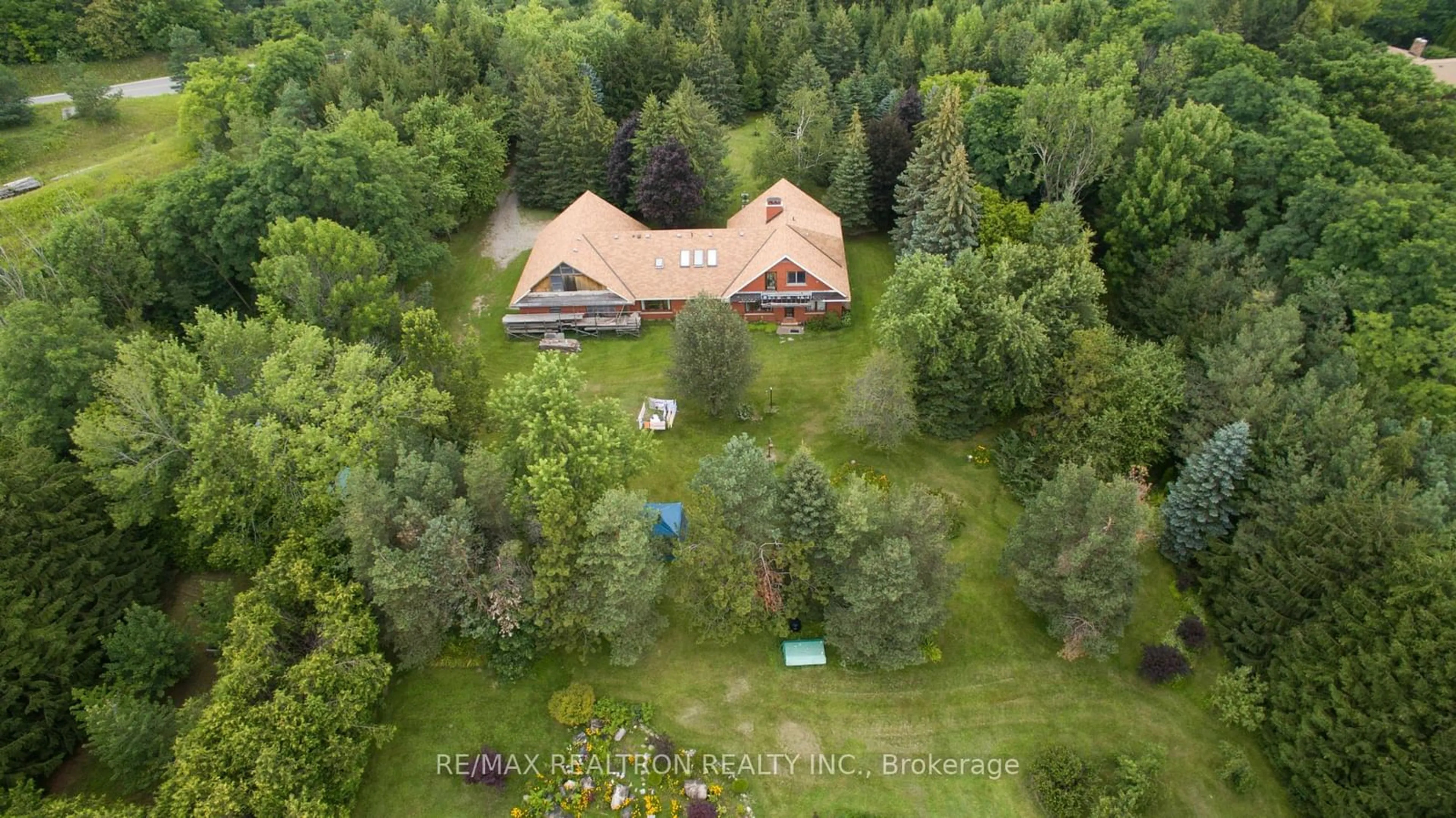 A pic from outside/outdoor area/front of a property/back of a property/a pic from drone, forest/trees view for 6019 6th Line, New Tecumseth Ontario L0G 1A0