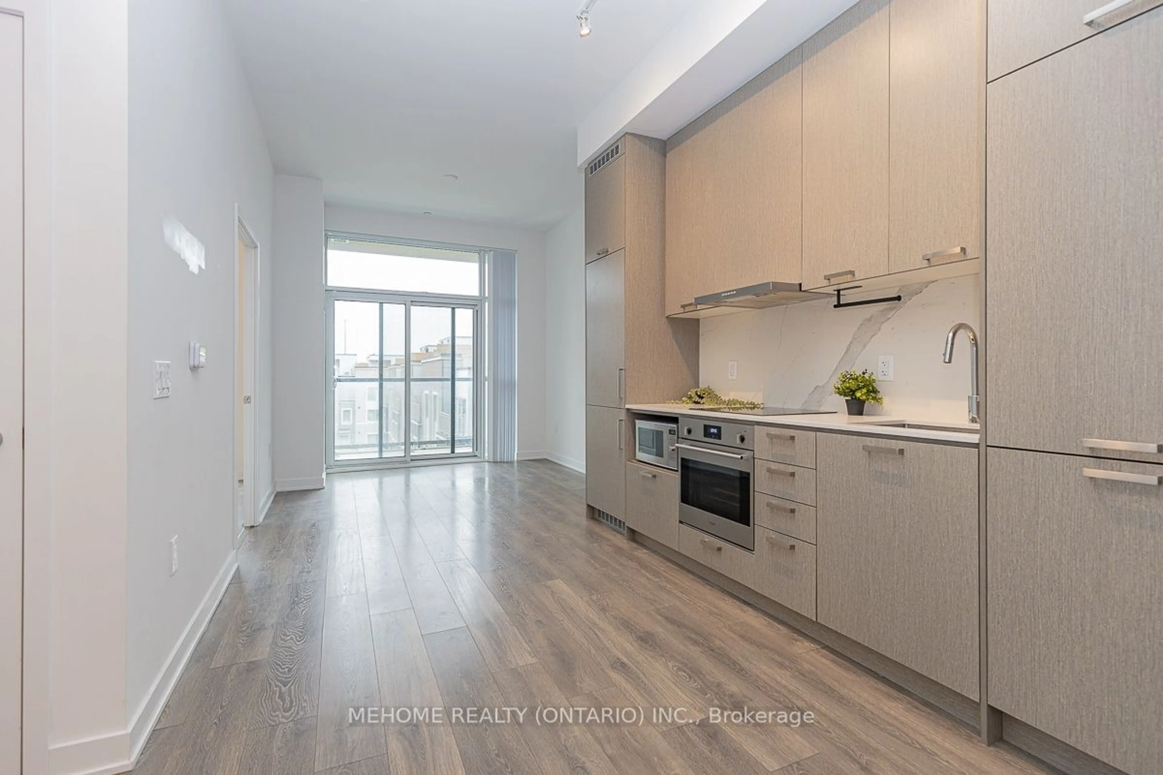 Open concept kitchen, wood/laminate floor for 38 Honeycrisp Dr #305, Vaughan Ontario L4K 0M8