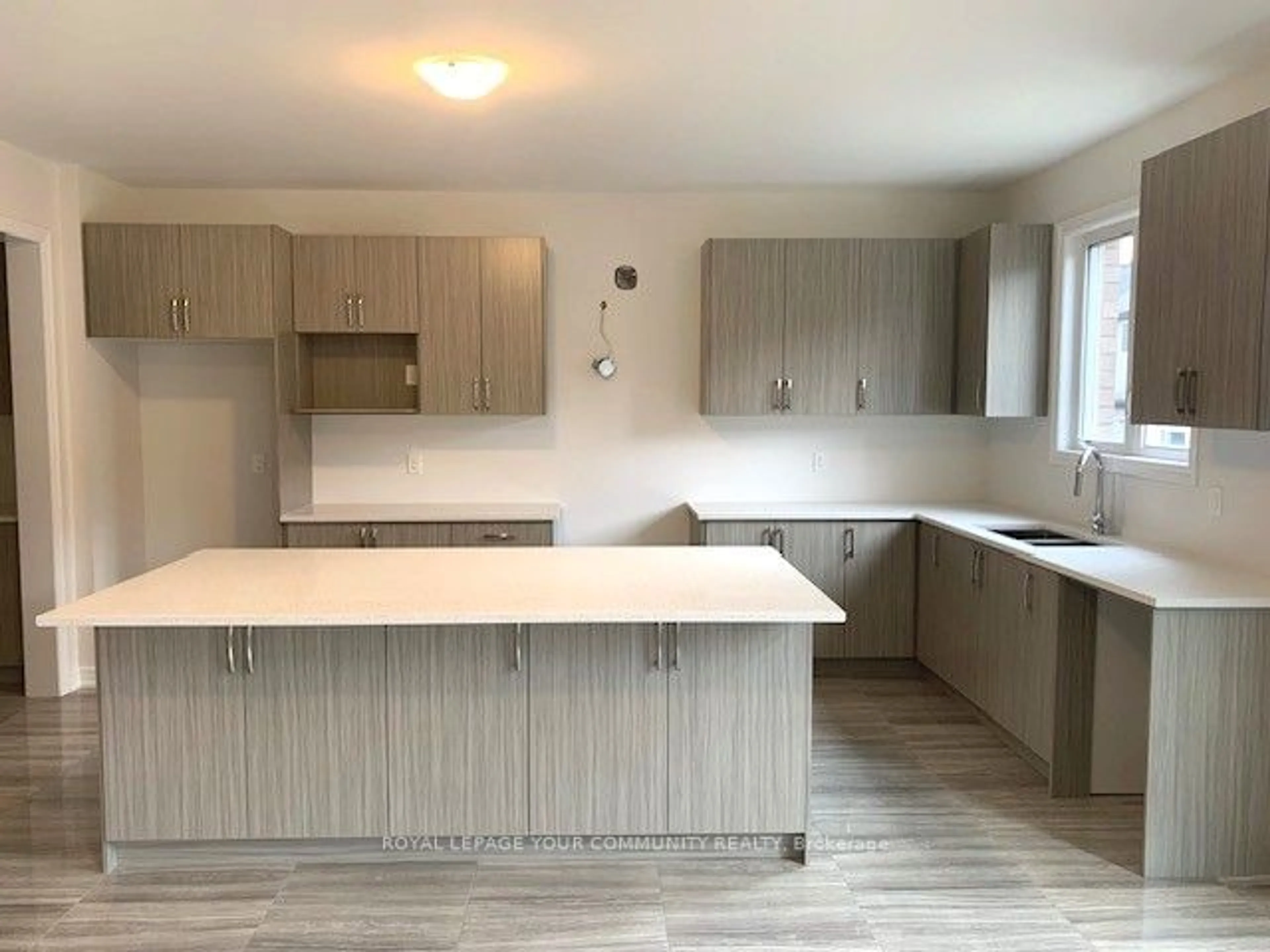 Open concept kitchen, wood/laminate floor for 61 Bud Leggett Cres, Georgina Ontario L4P 0T1