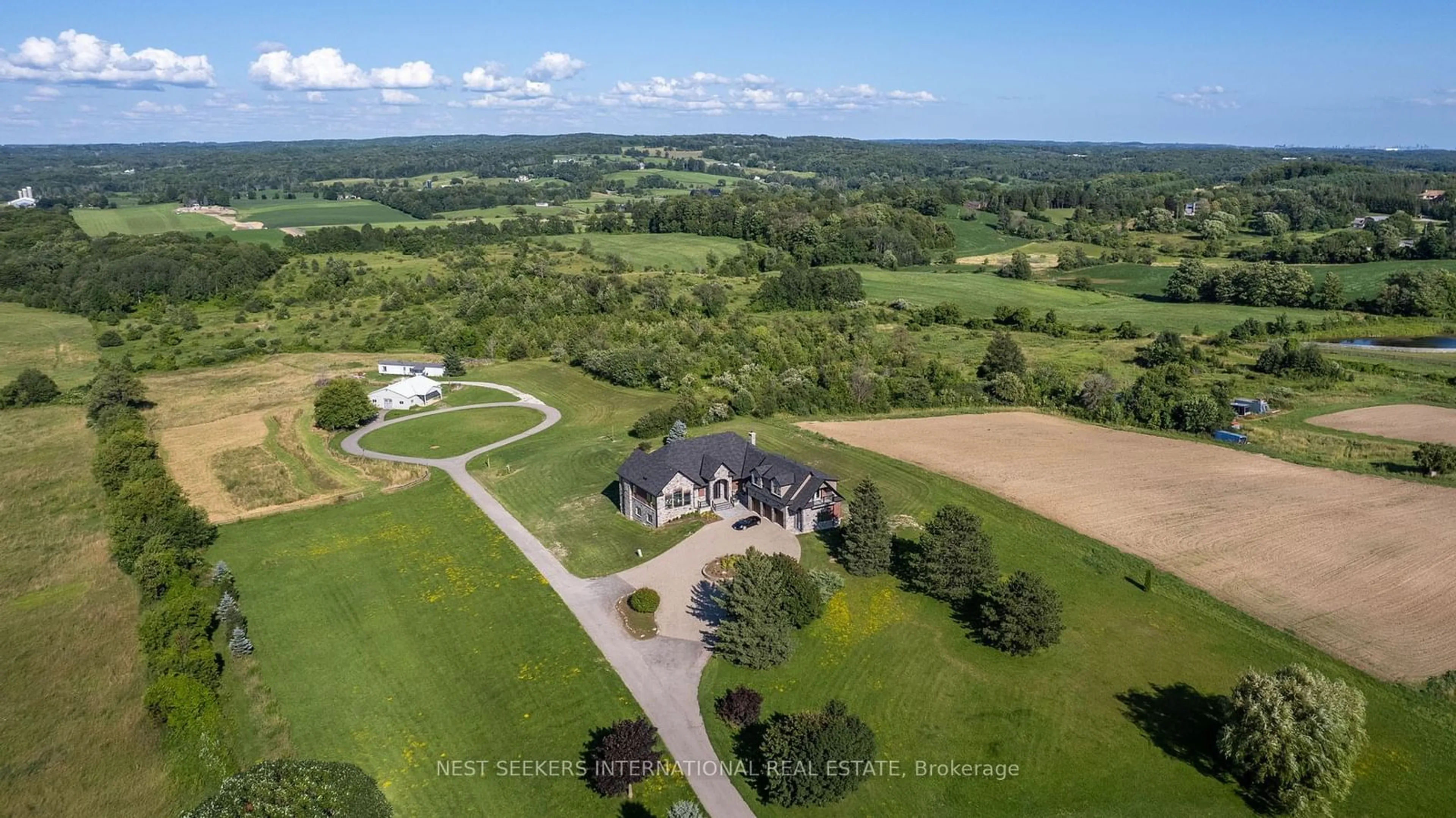 A pic from outside/outdoor area/front of a property/back of a property/a pic from drone, water/lake/river/ocean view for 15535 Highway 27, King Ontario L0G 1T0