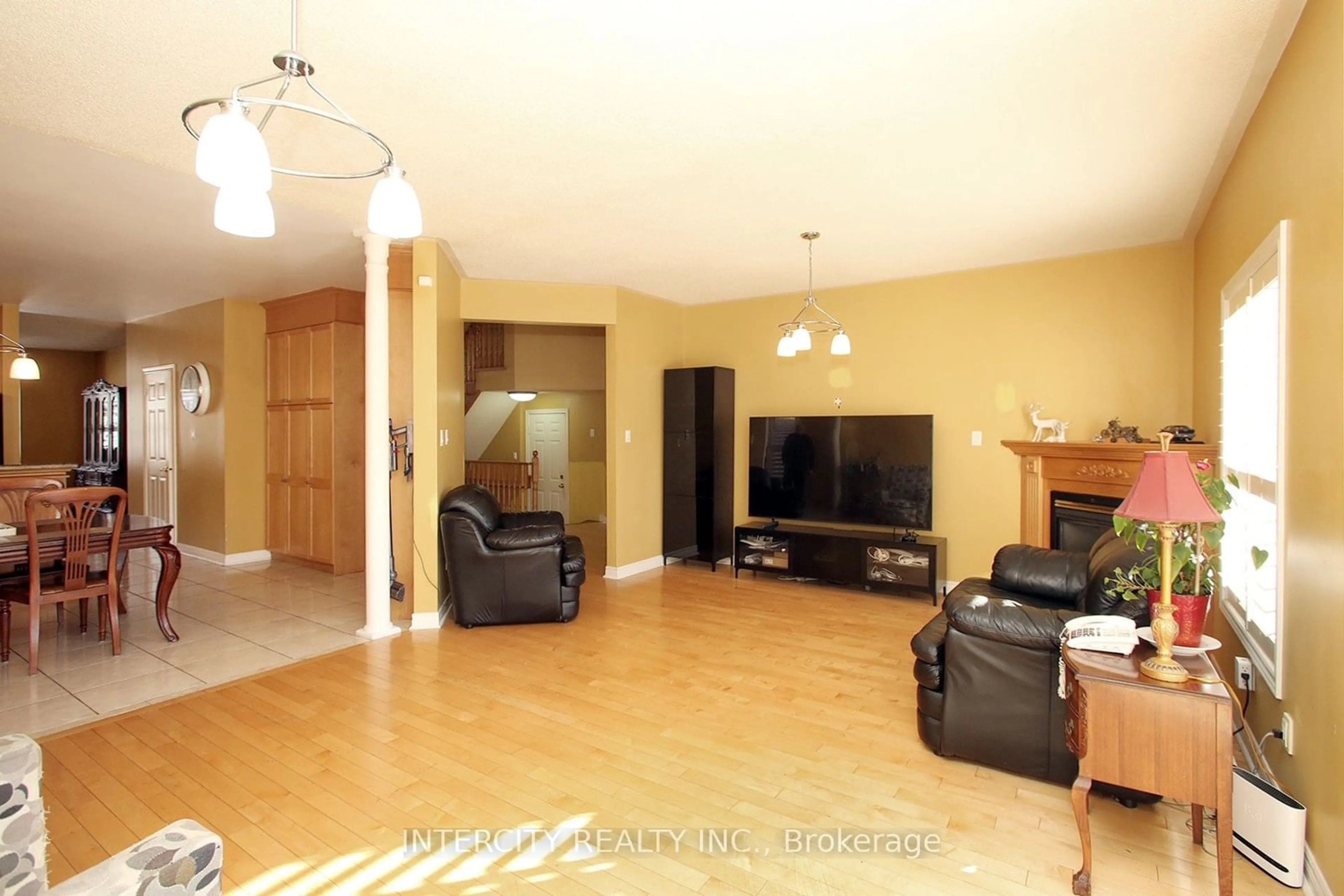 Living room with furniture, wood/laminate floor for 36 Woodland Trail Crt, Vaughan Ontario L4L 9H9