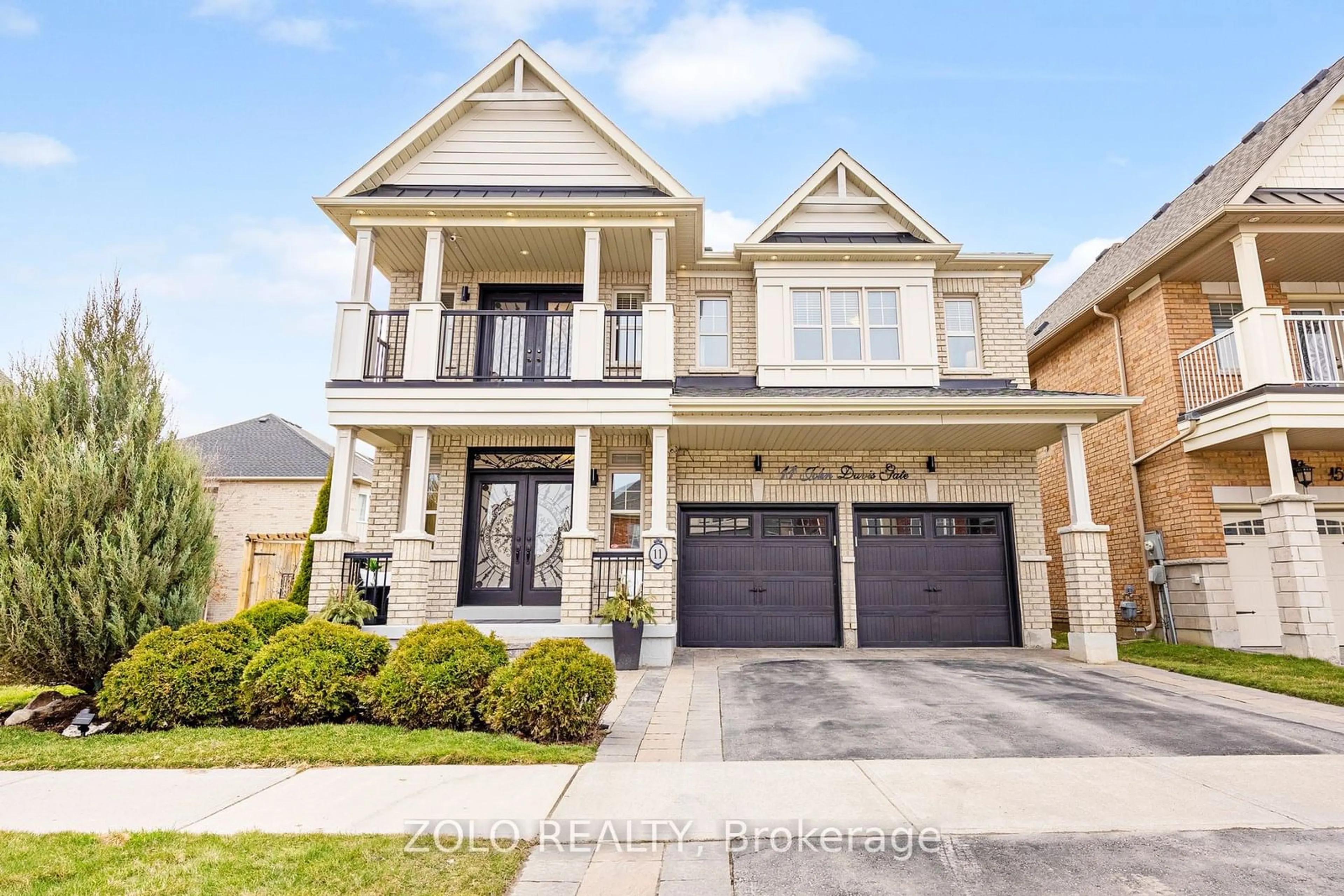 Home with brick exterior material, street for 11 John Davis Gate, Whitchurch-Stouffville Ontario L4A 1V5