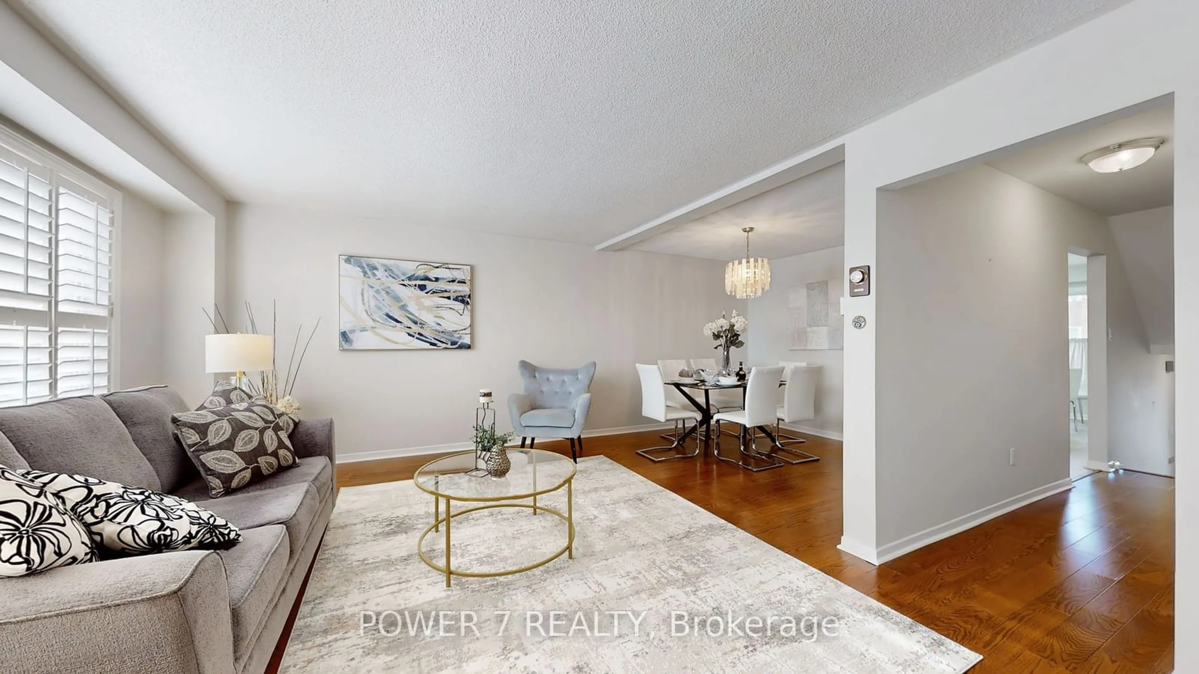 Living room with furniture, wood/laminate floor for 65 Nottinghill Rd, Markham Ontario L3T 4Y3