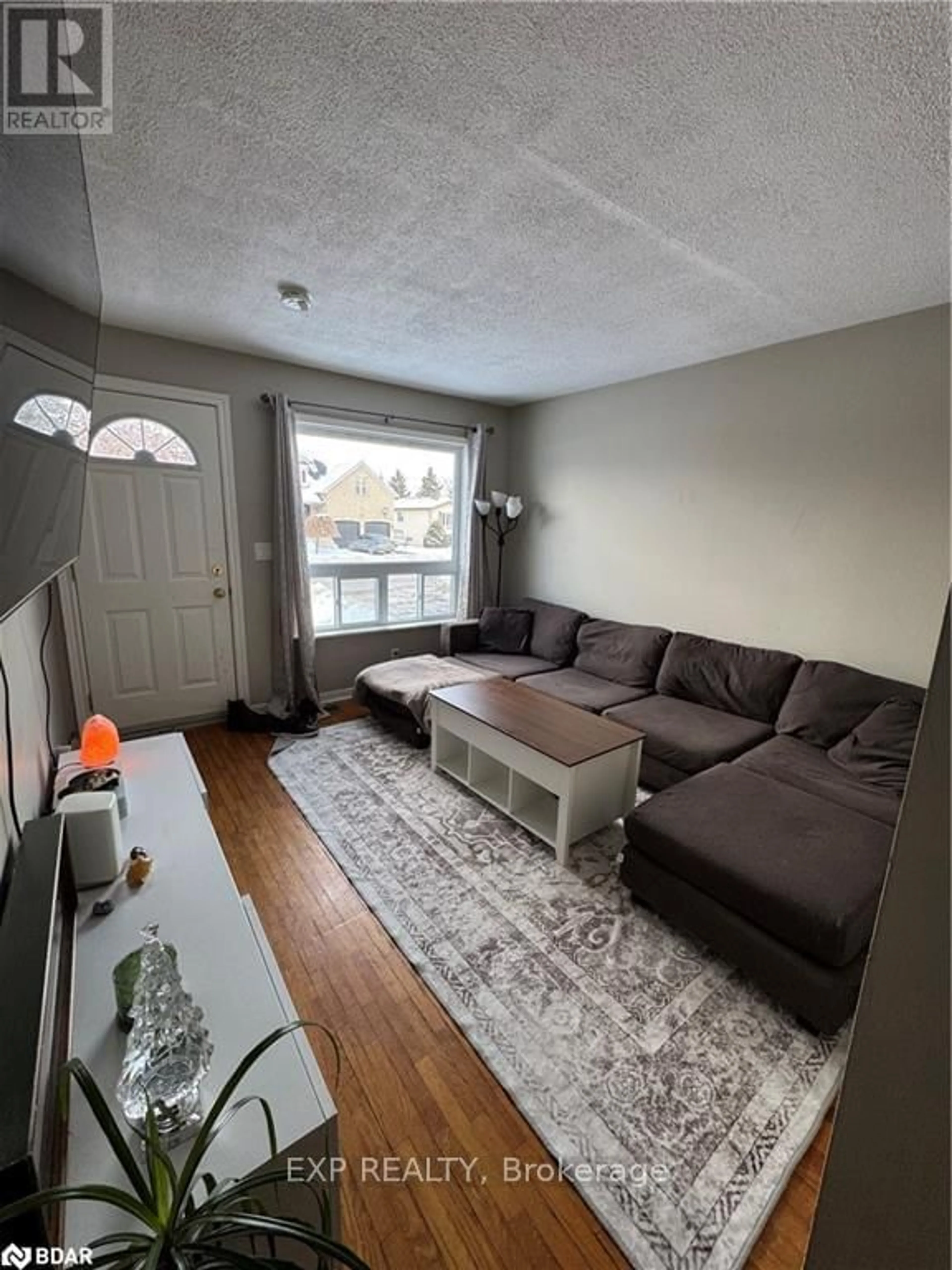 Living room with furniture, unknown for 34-36 Centre St, Essa Ontario L0M 1B0