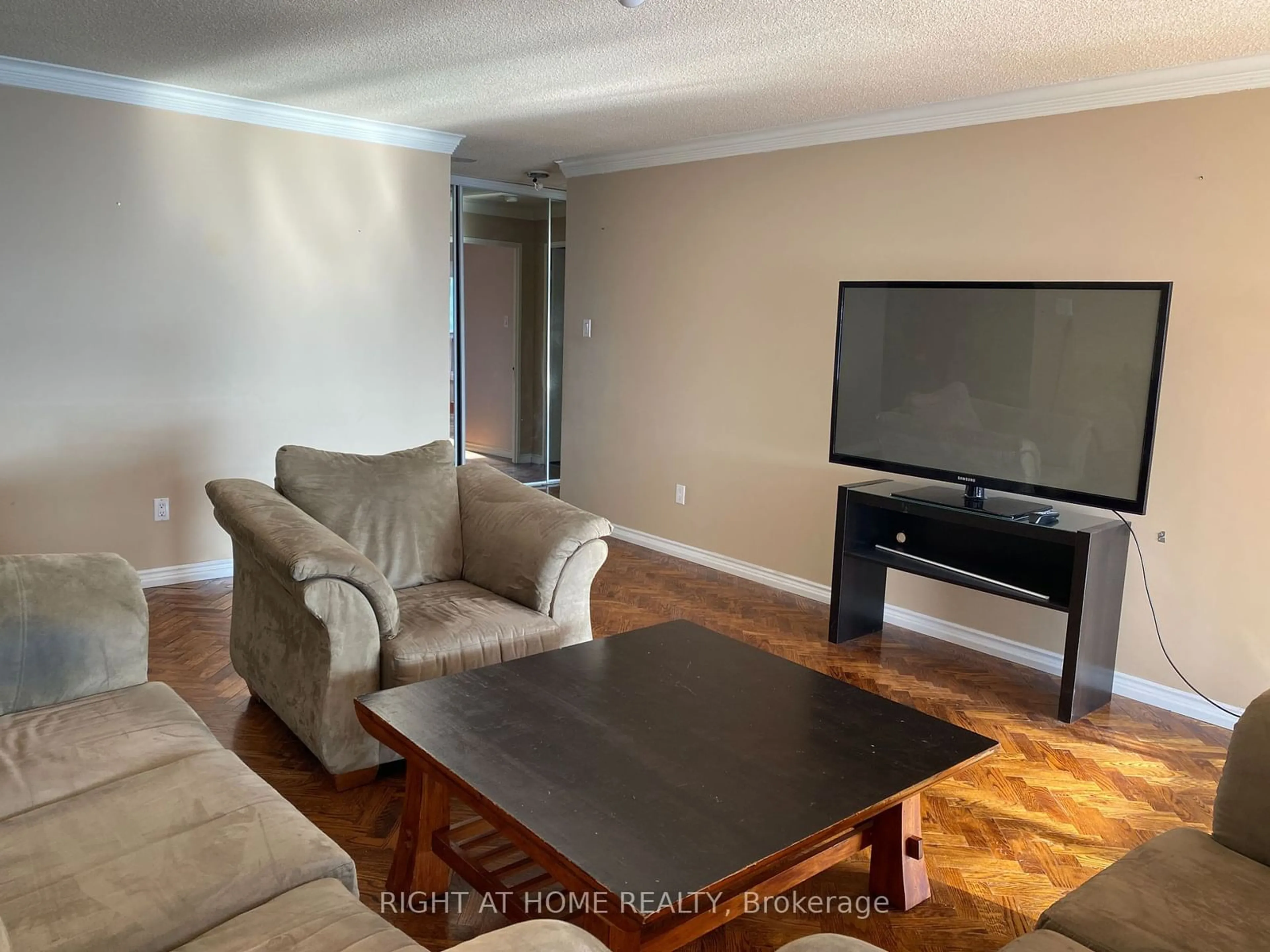 Living room with furniture, wood/laminate floor for 1 Clark Ave #1711, Vaughan Ontario L4J 7Y6