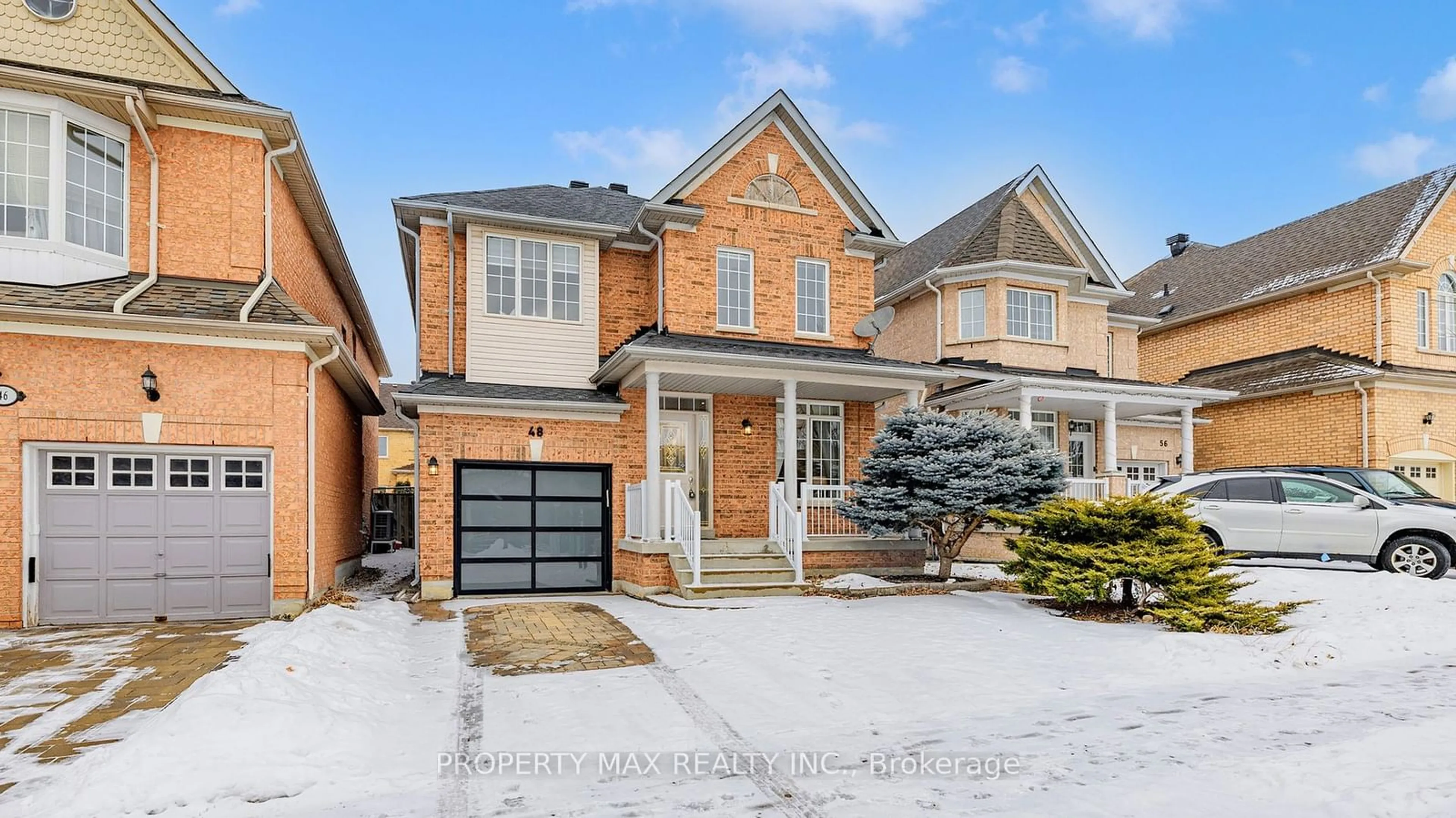 Home with brick exterior material, street for 48 Elmrill Rd, Markham Ontario L6C 2P1