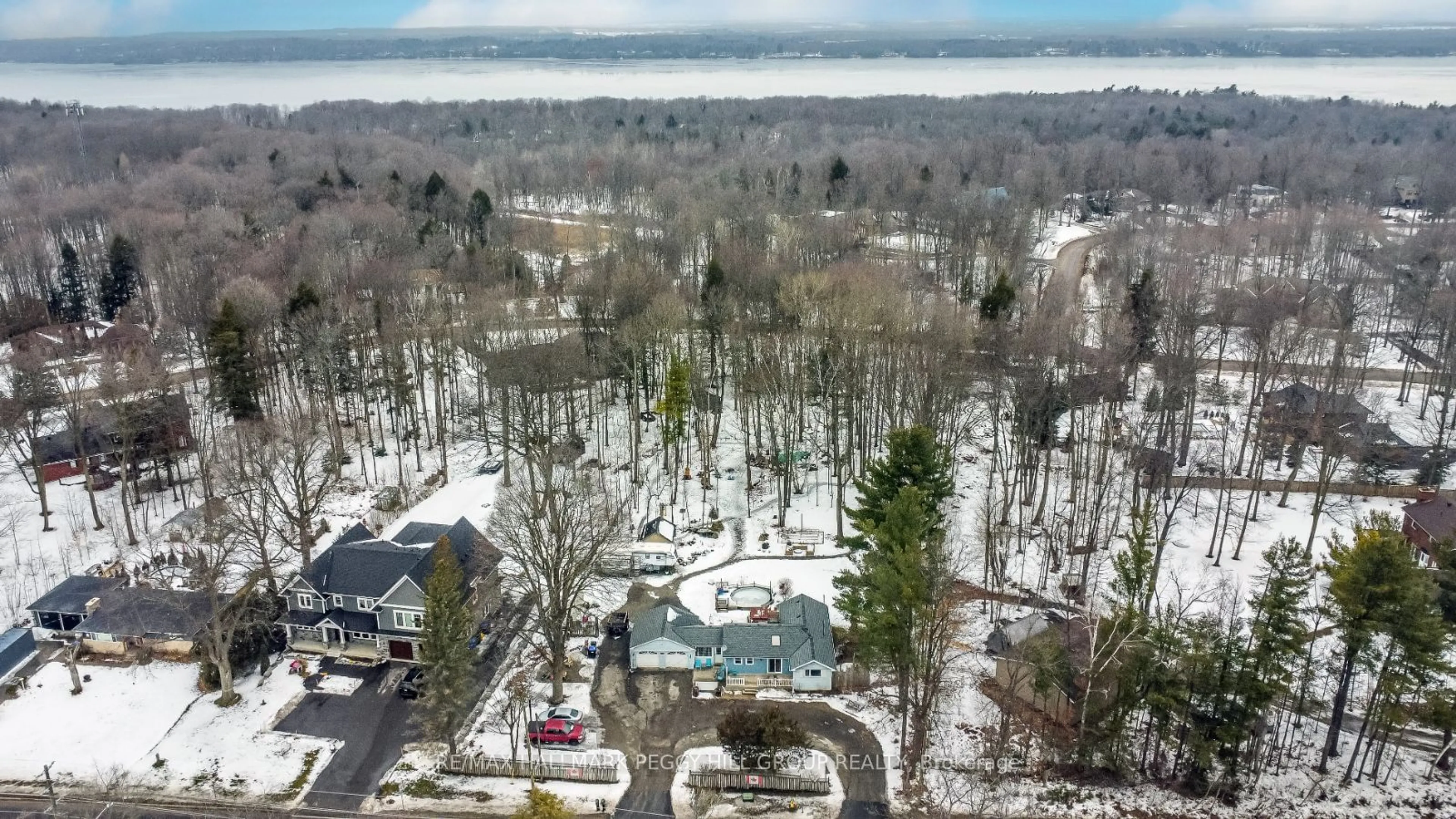 A pic from outside/outdoor area/front of a property/back of a property/a pic from drone, forest/trees view for 1776 BIG BAY POINT Rd, Innisfil Ontario L9S 2R4