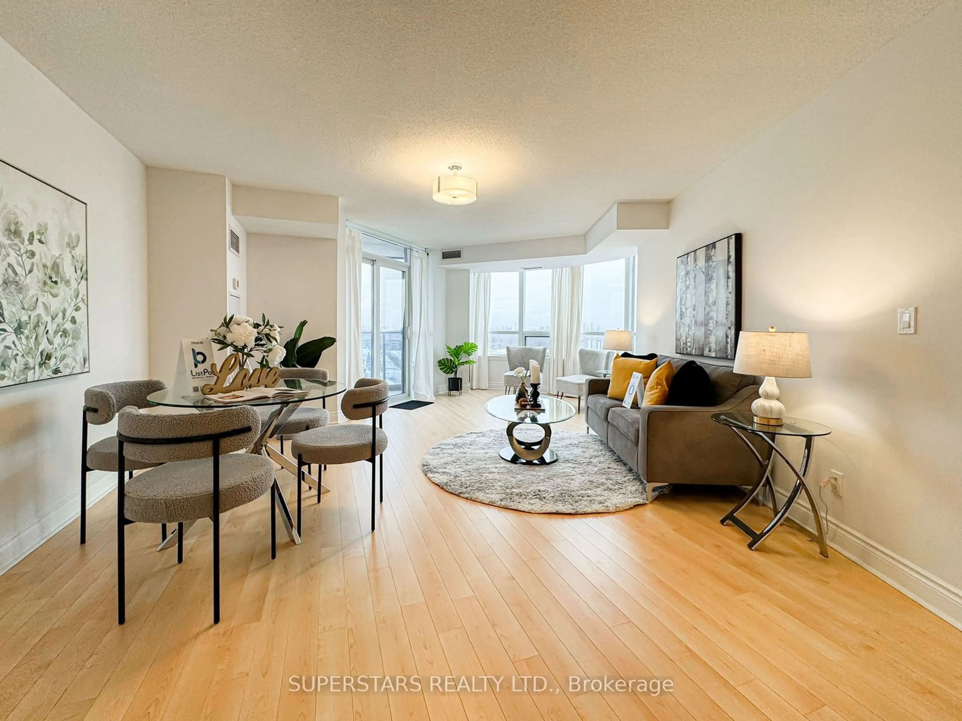 Living room with furniture, wood/laminate floor for 23 Cox Blvd #1063, Markham Ontario L3R 7Z9