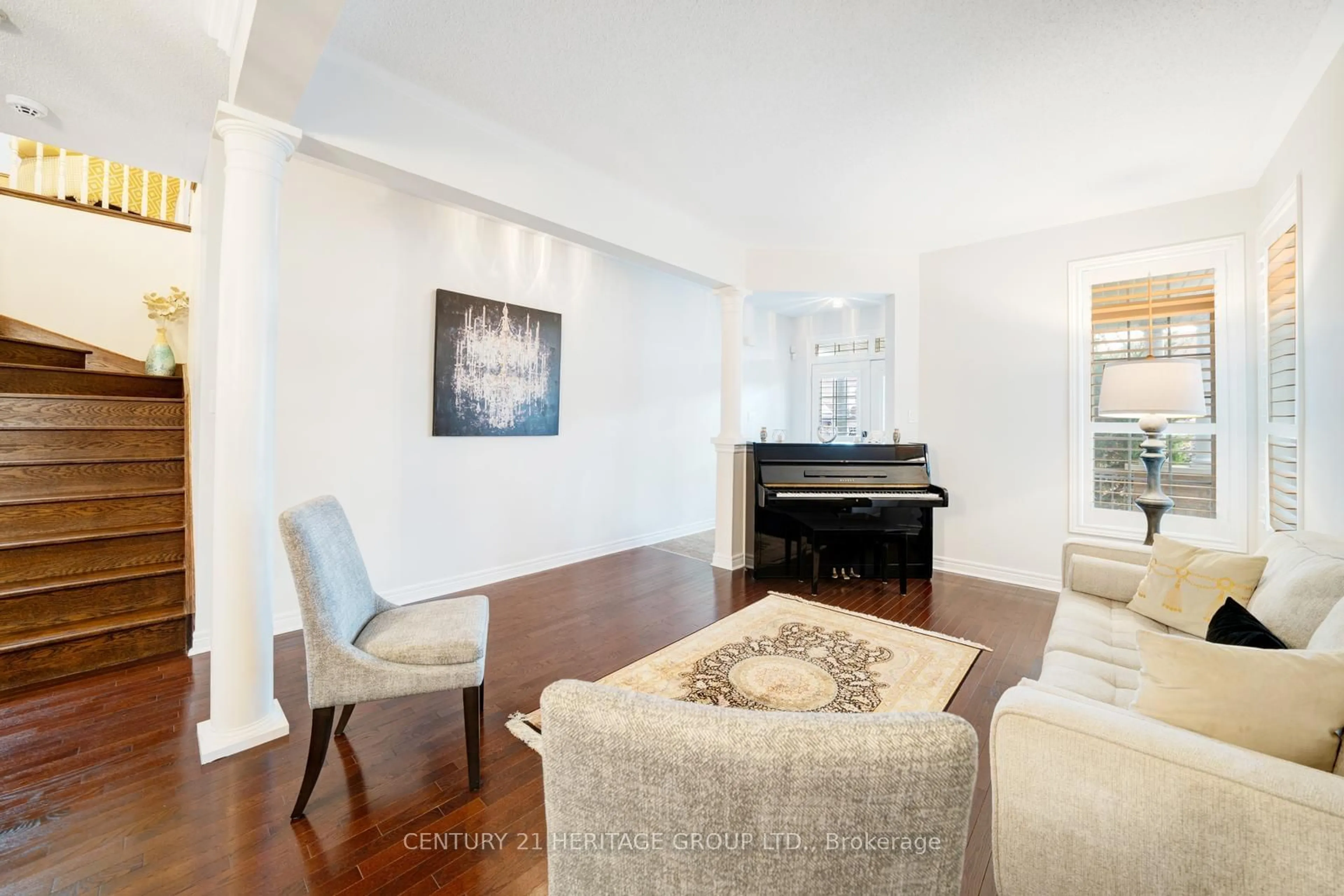 Living room with furniture, wood/laminate floor for 173 Wainscot Ave, Newmarket Ontario L3X 2X4