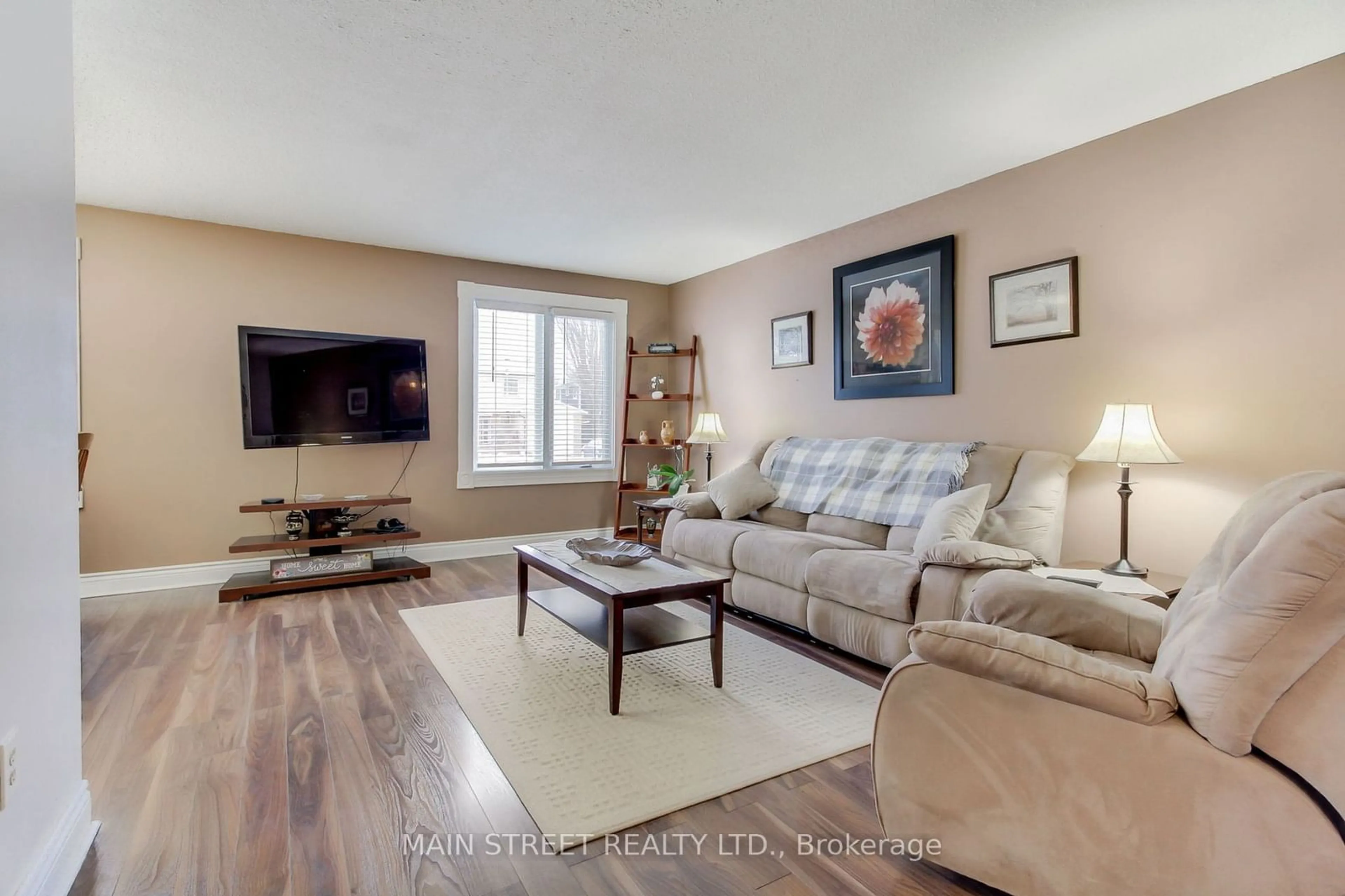 Living room with furniture, wood/laminate floor for 453 Dixon Blvd, Newmarket Ontario L3Y 5C9