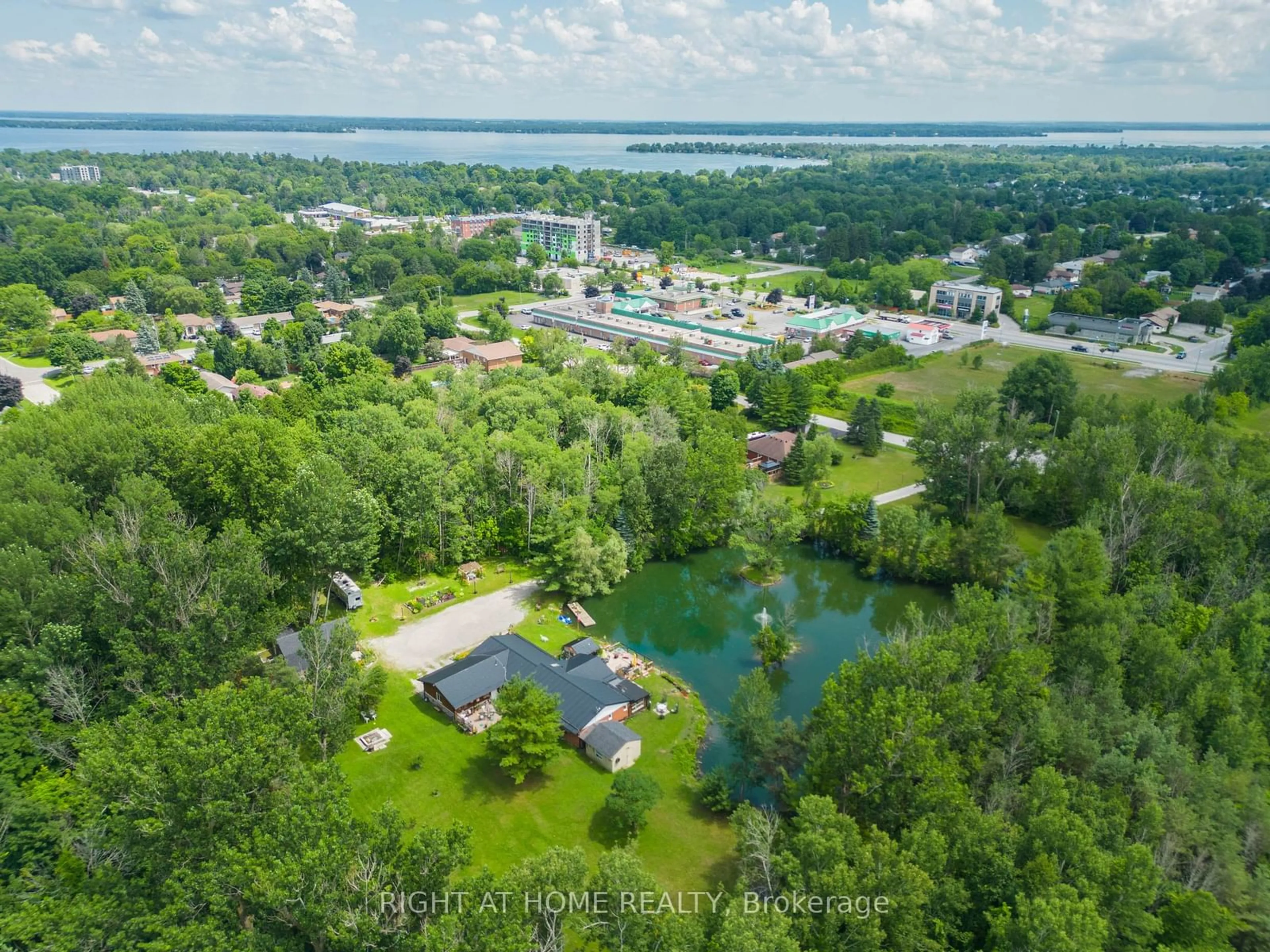 A pic from outside/outdoor area/front of a property/back of a property/a pic from drone, water/lake/river/ocean view for 1114 Goshen Rd, Innisfil Ontario L9S 2M5