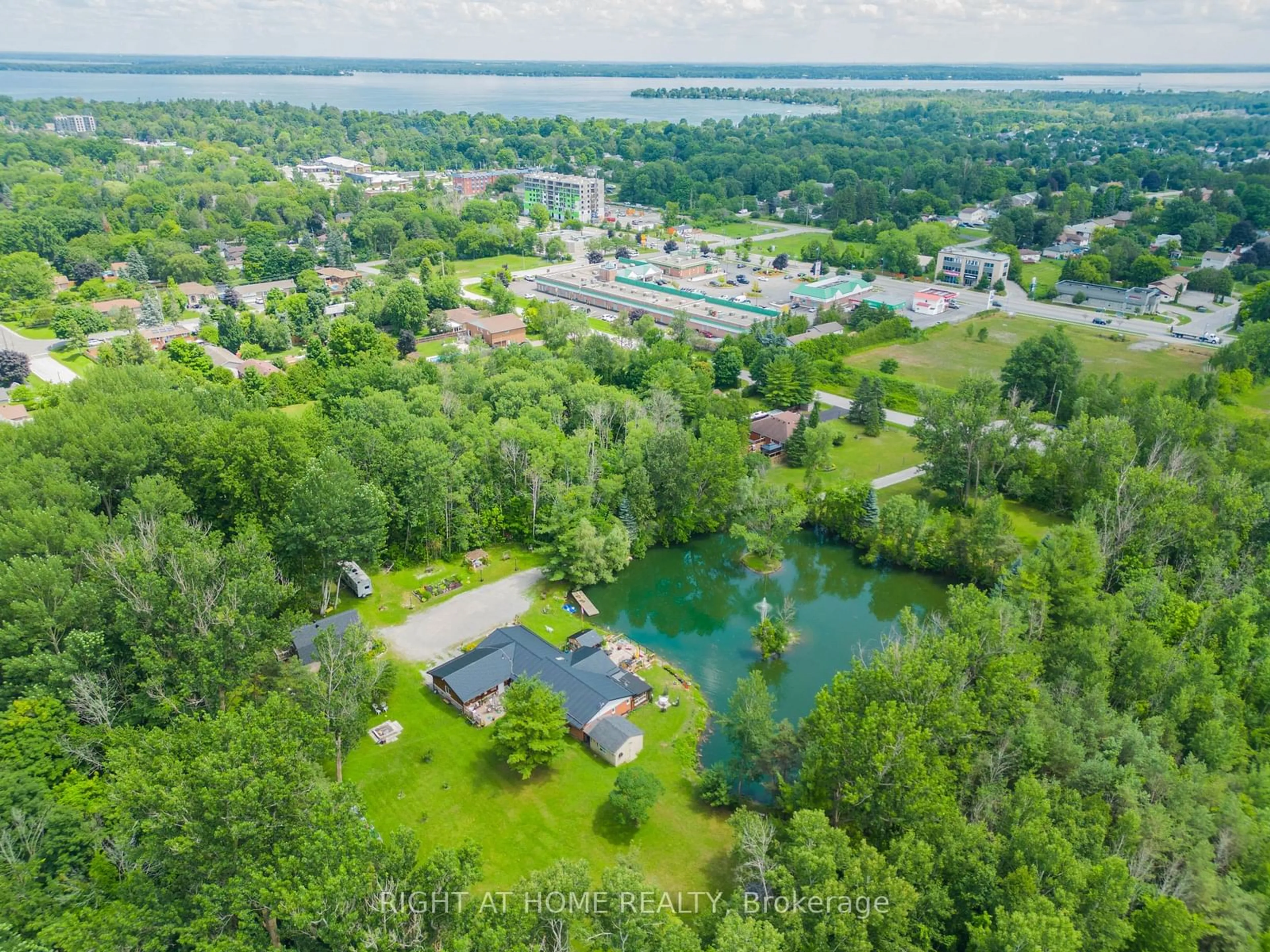 A pic from outside/outdoor area/front of a property/back of a property/a pic from drone, water/lake/river/ocean view for 1114 Goshen Rd, Innisfil Ontario L9S 2M5