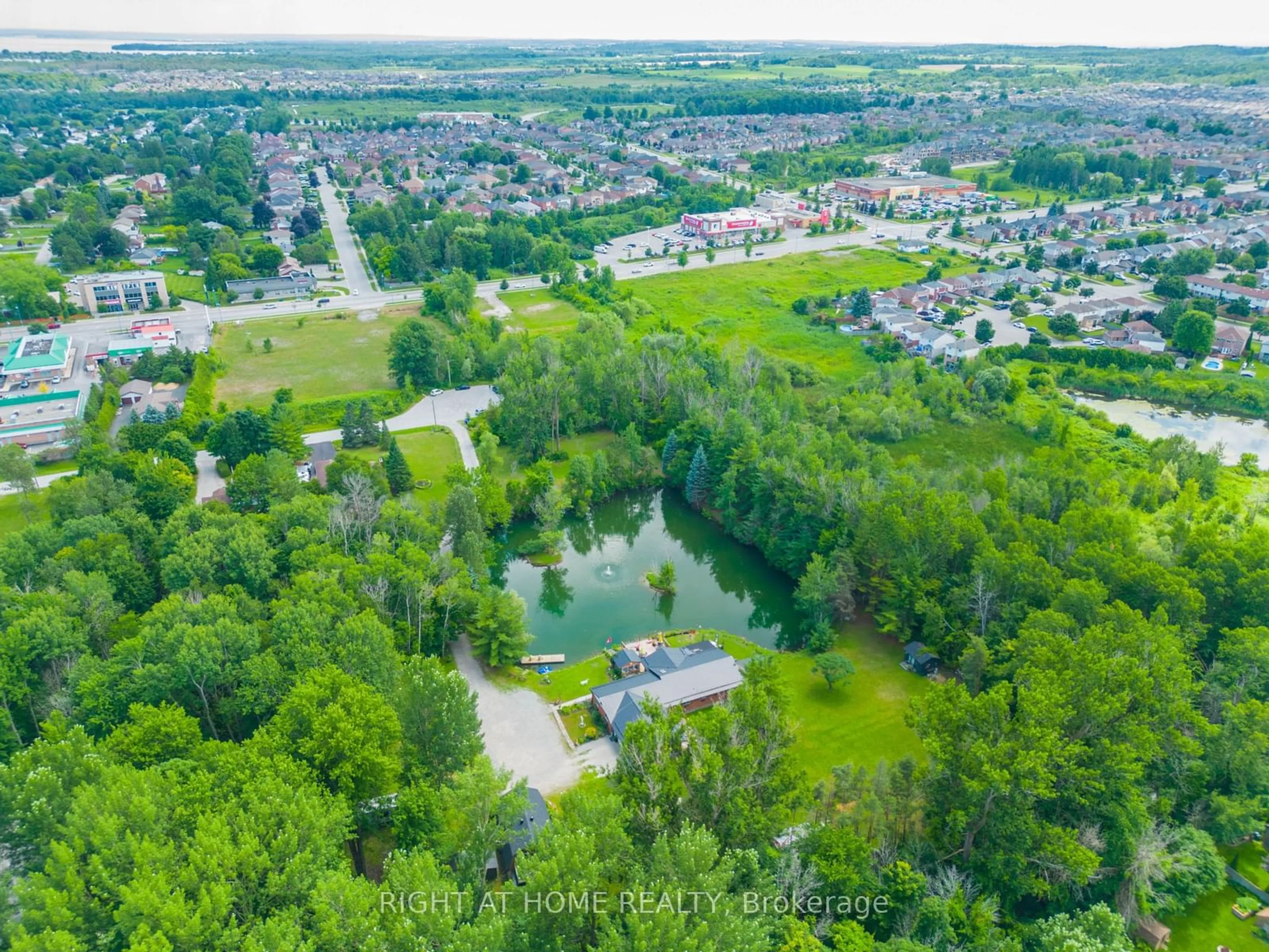 A pic from outside/outdoor area/front of a property/back of a property/a pic from drone, water/lake/river/ocean view for 1114 Goshen Rd, Innisfil Ontario L9S 2M5