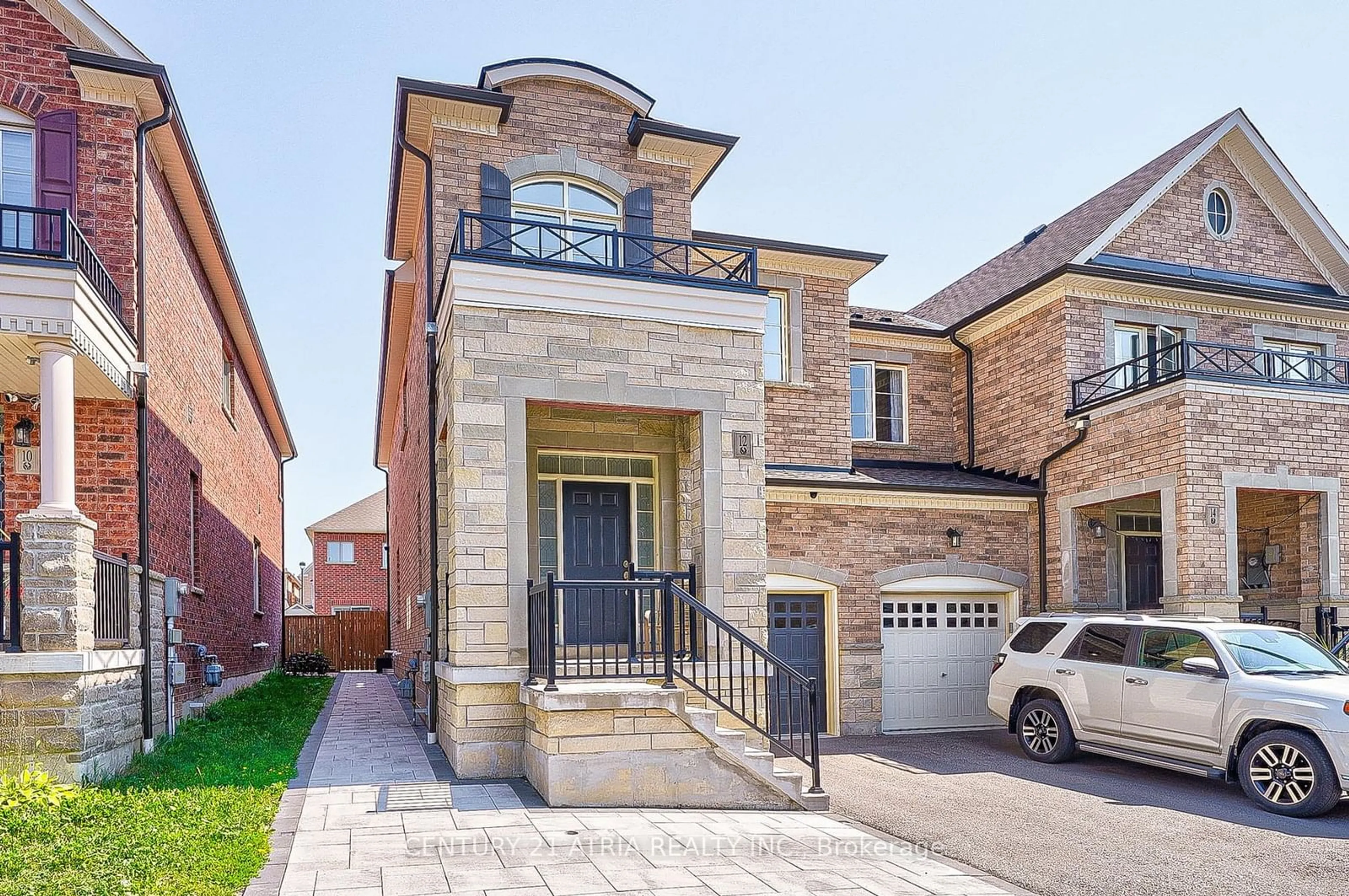 Home with brick exterior material, street for 12 Twinflower Lane, Richmond Hill Ontario L4E 1E7