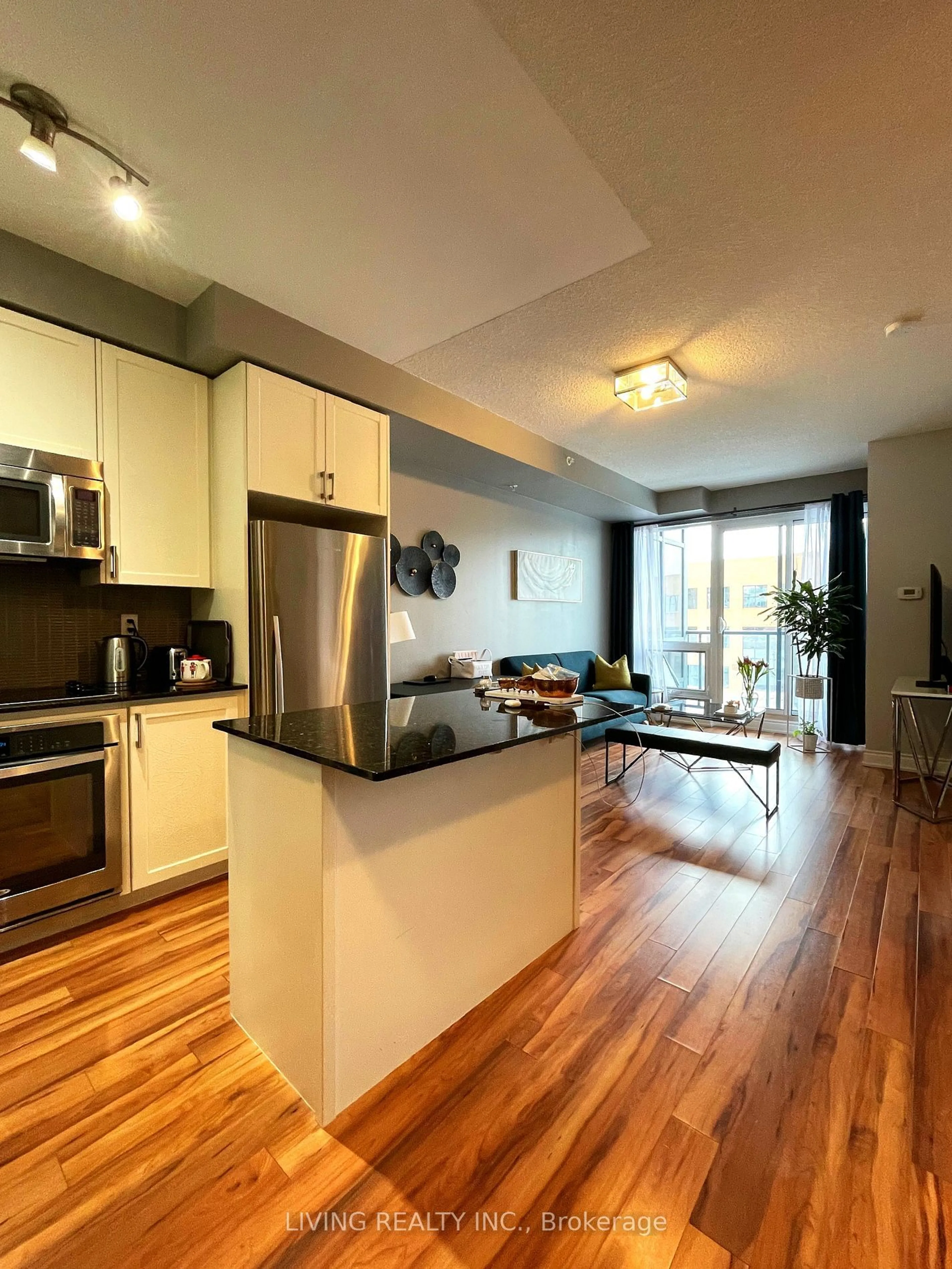 Open concept kitchen, wood/laminate floor for 9088 Yonge St #509A, Richmond Hill Ontario L4C 0Y6