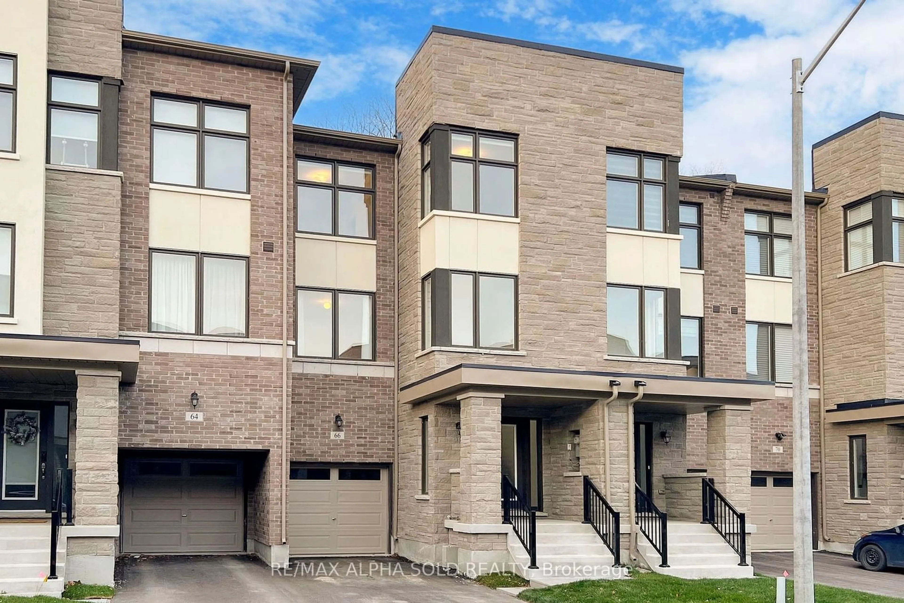 Home with brick exterior material, street for 66 Puisaya Dr, Richmond Hill Ontario L4E 1L2