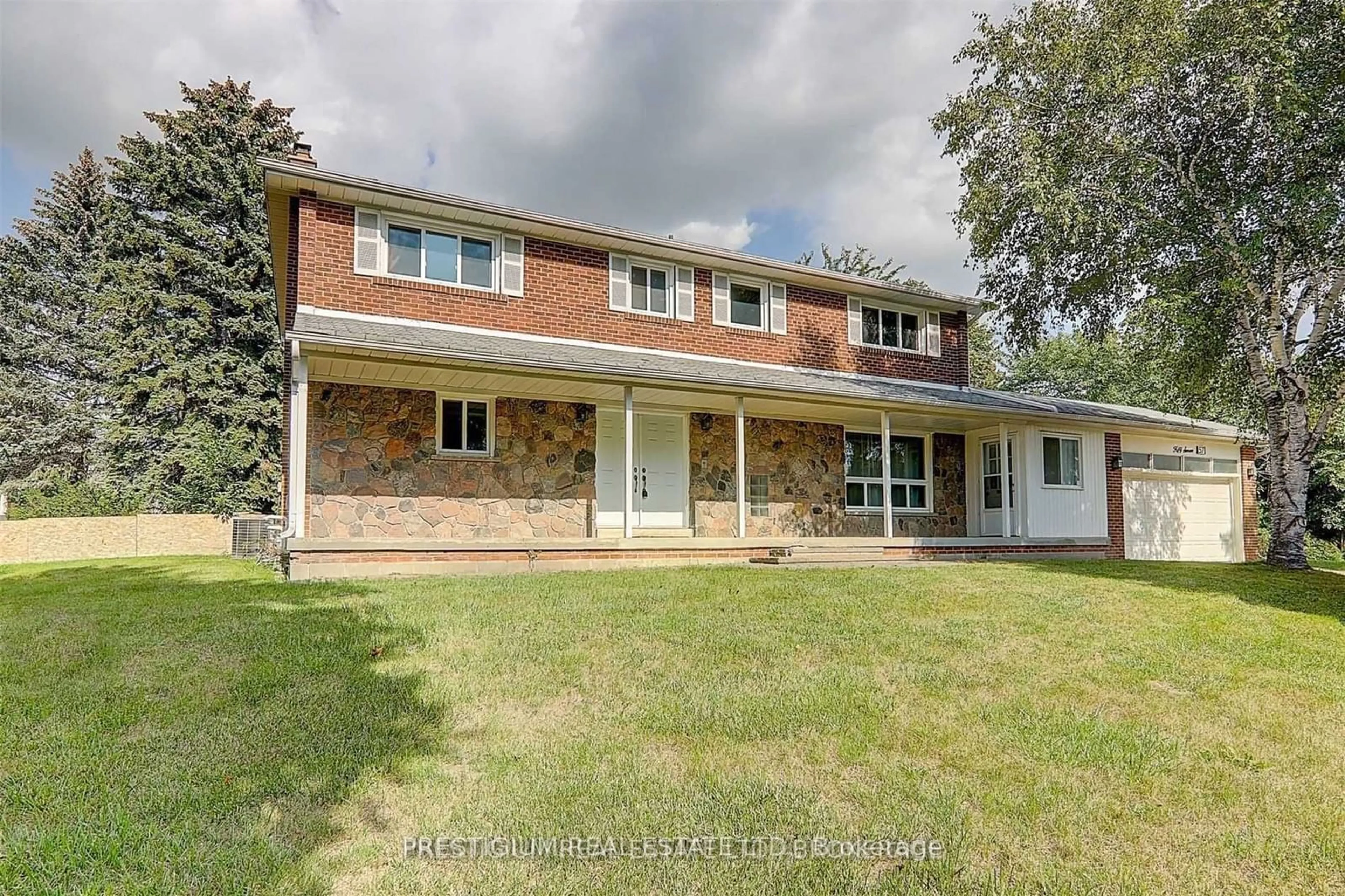 Home with brick exterior material, street for 57 Laureleaf Rd, Markham Ontario L3T 2X9