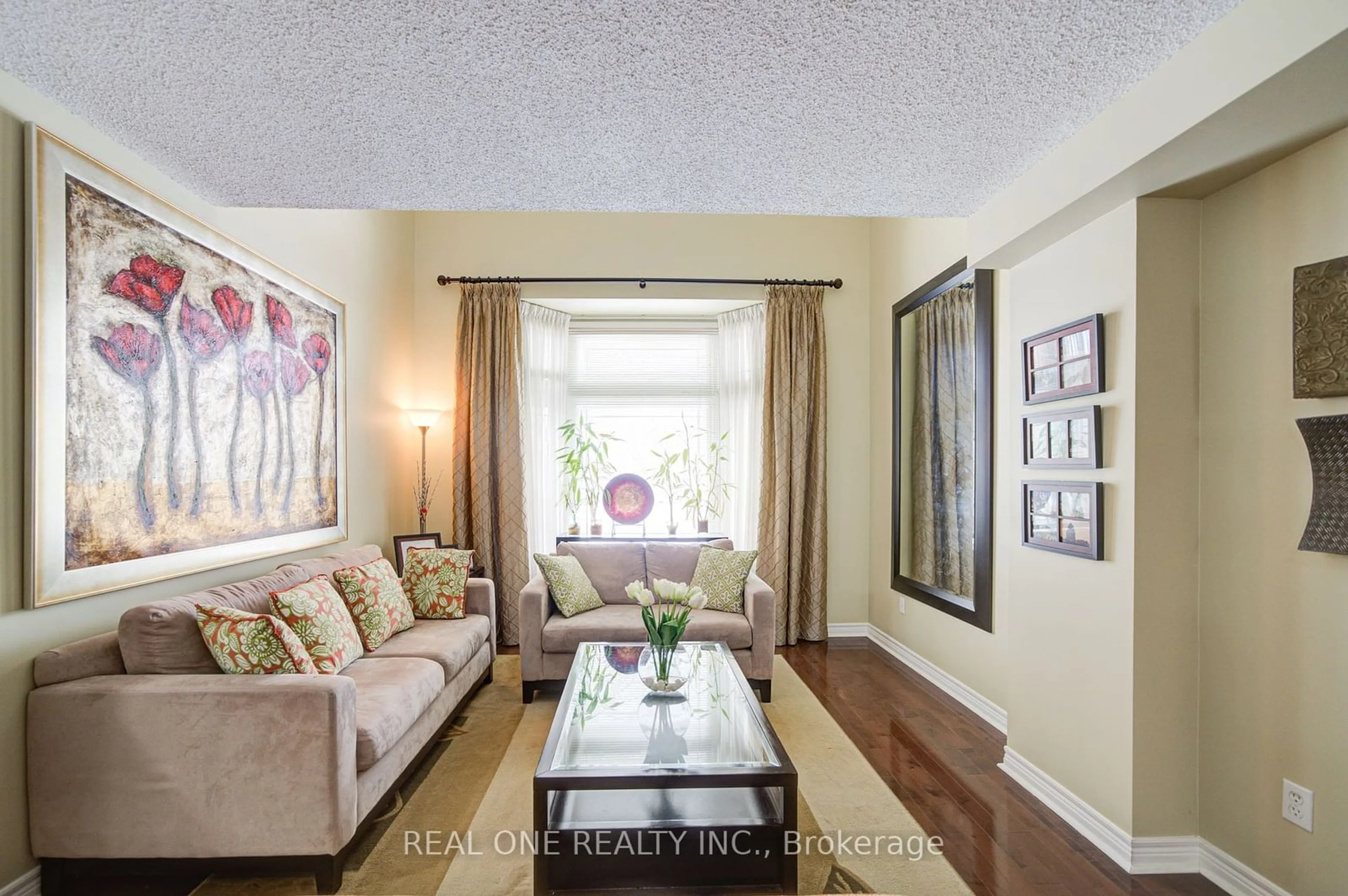 Living room with furniture, wood/laminate floor for 40 Primrose Path Cres, Markham Ontario L3S 4A9