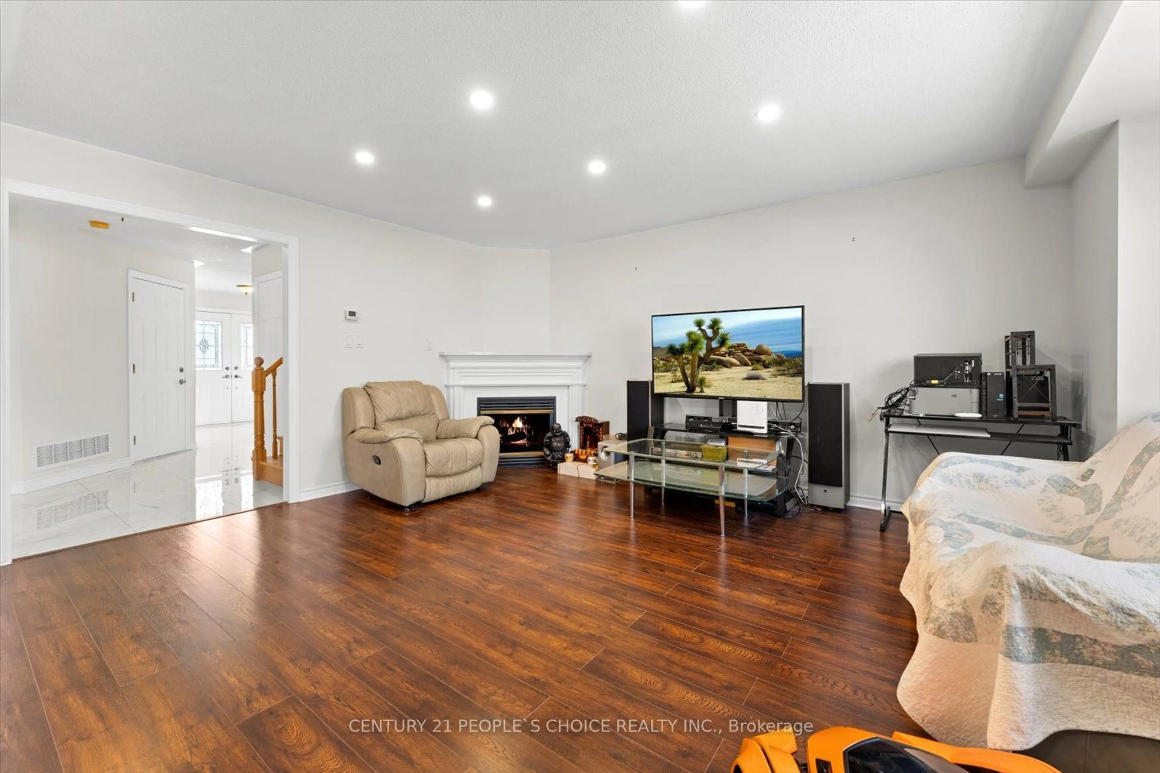 Living room with furniture, wood/laminate floor for 26 Rainbow Crt, Georgina Ontario L4P 3Z6