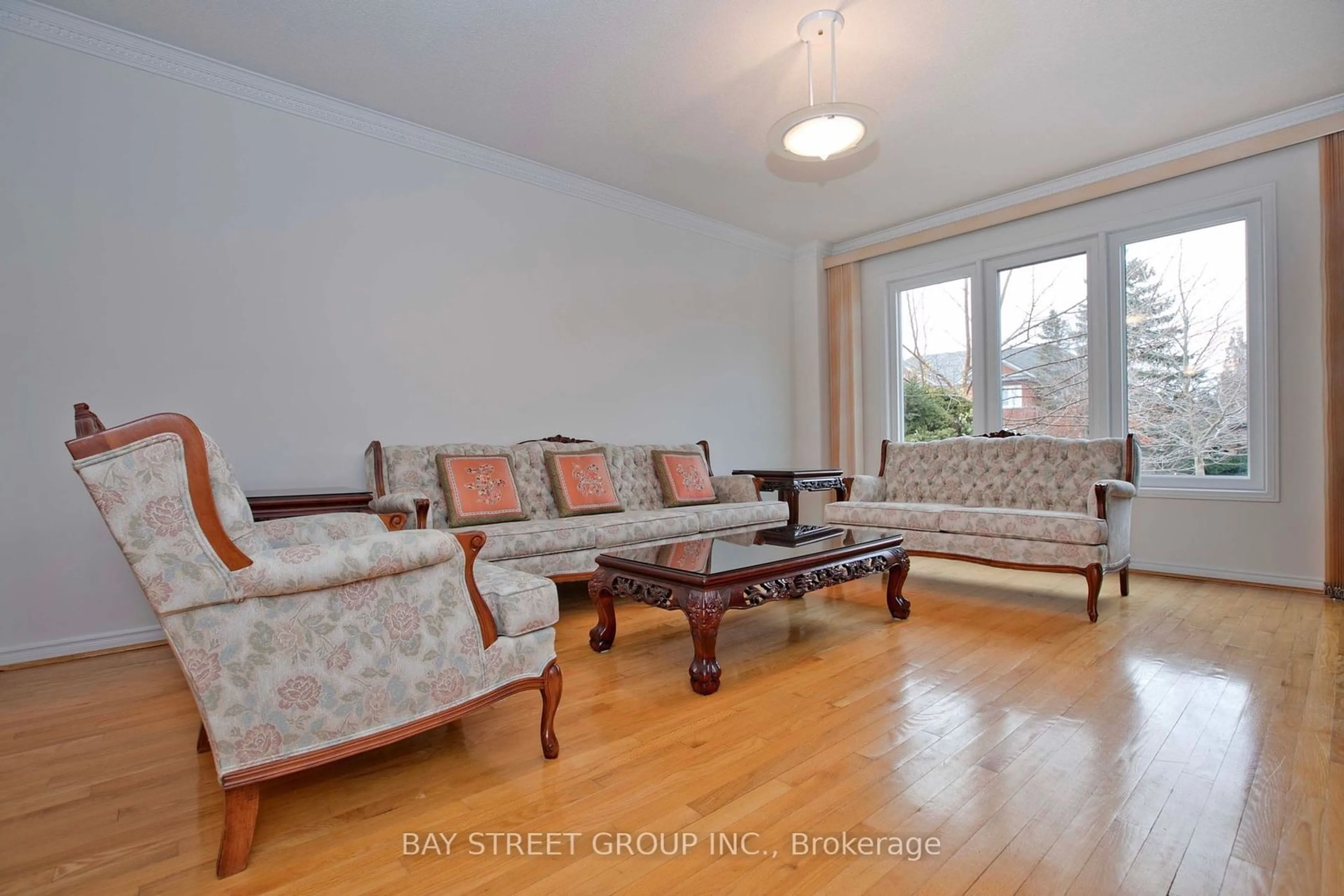 Living room with furniture, wood/laminate floor for 29 Webber Cres, Markham Ontario L3R 2L3