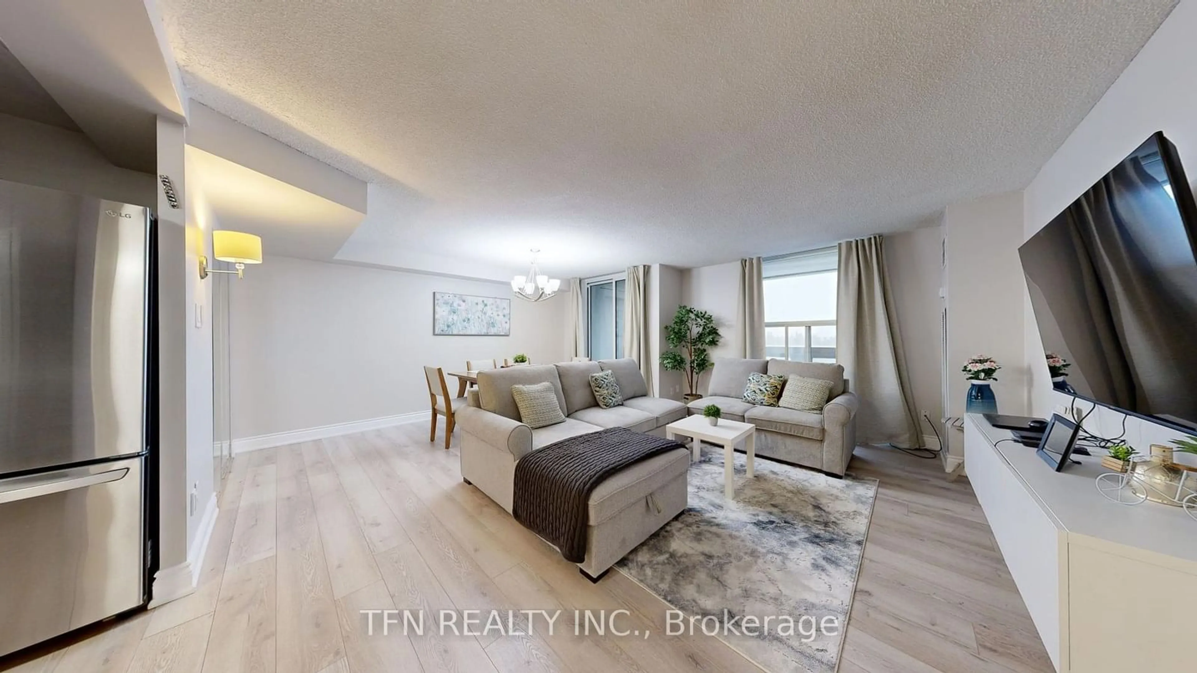 Living room with furniture, wood/laminate floor for 60 Inverlochy Blvd #1105, Markham Ontario L3T 4T7