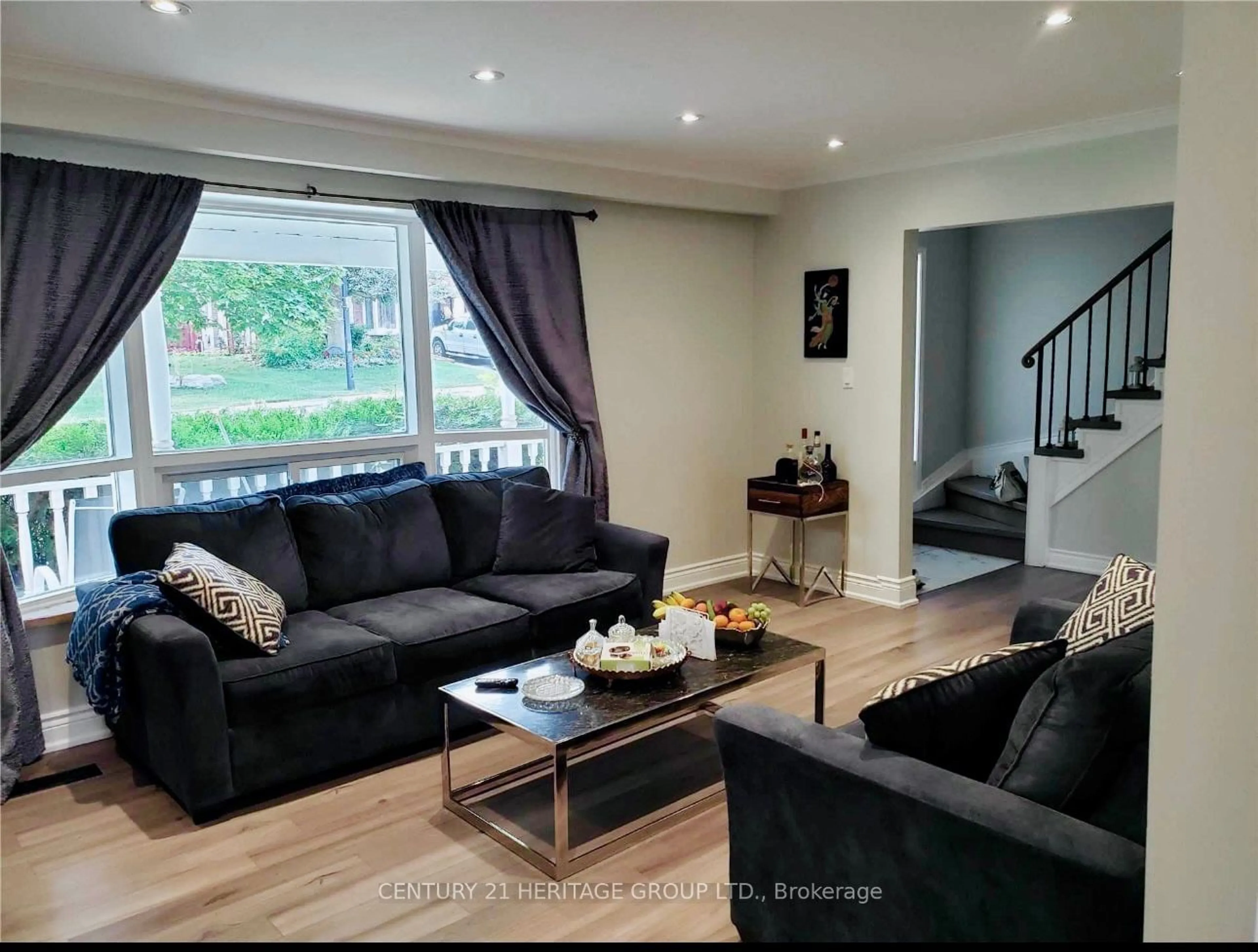 Living room with furniture, wood/laminate floor for 307 Towercrest Dr, Newmarket Ontario L3Y 1C1