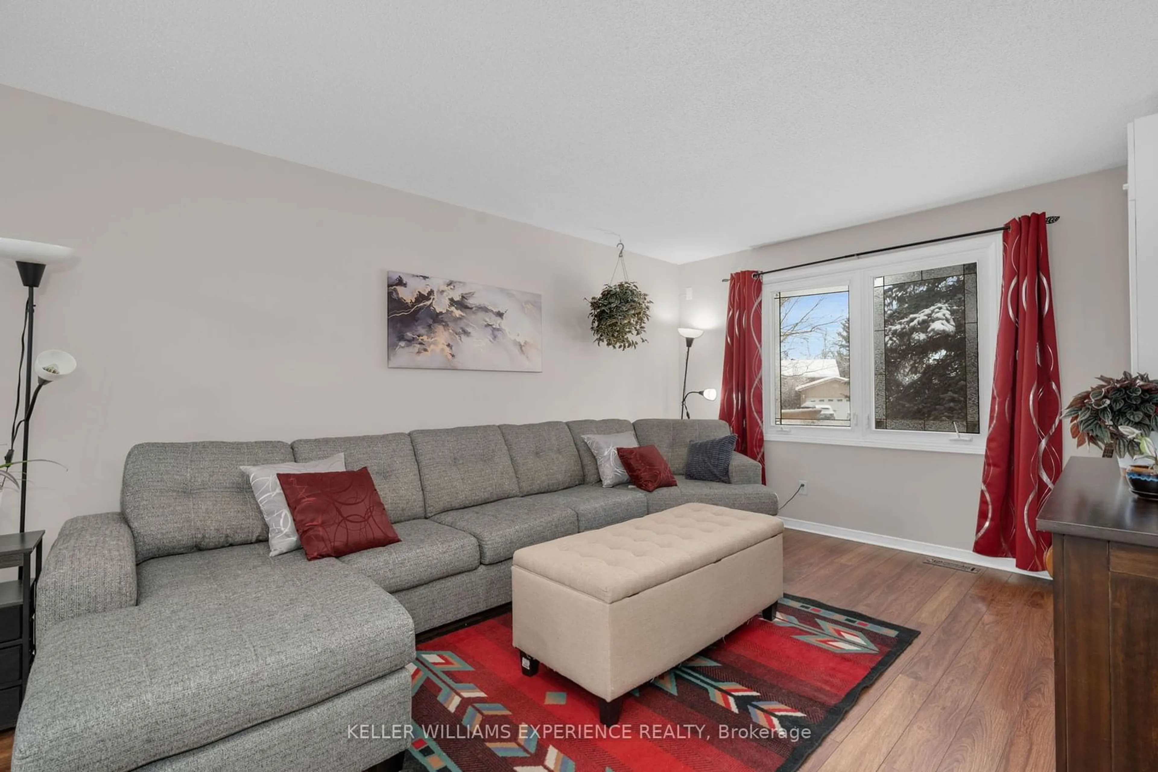 Living room with furniture, wood/laminate floor for 13 Robertson Rd, Essa Ontario L3W 0J5