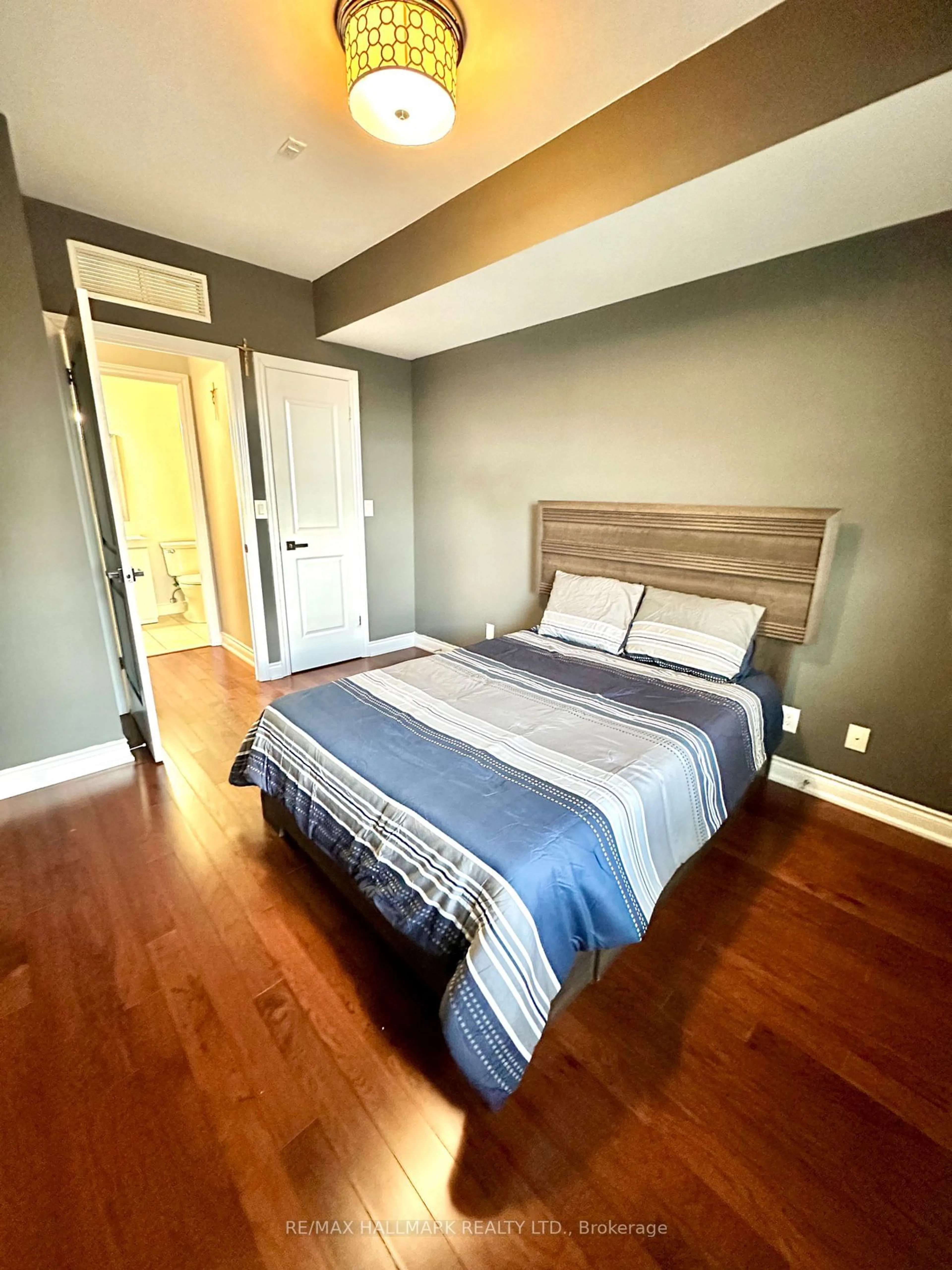 Bedroom with bed, wood/laminate floor for 281 Woodbridge Ave #410, Vaughan Ontario L4L 0C6