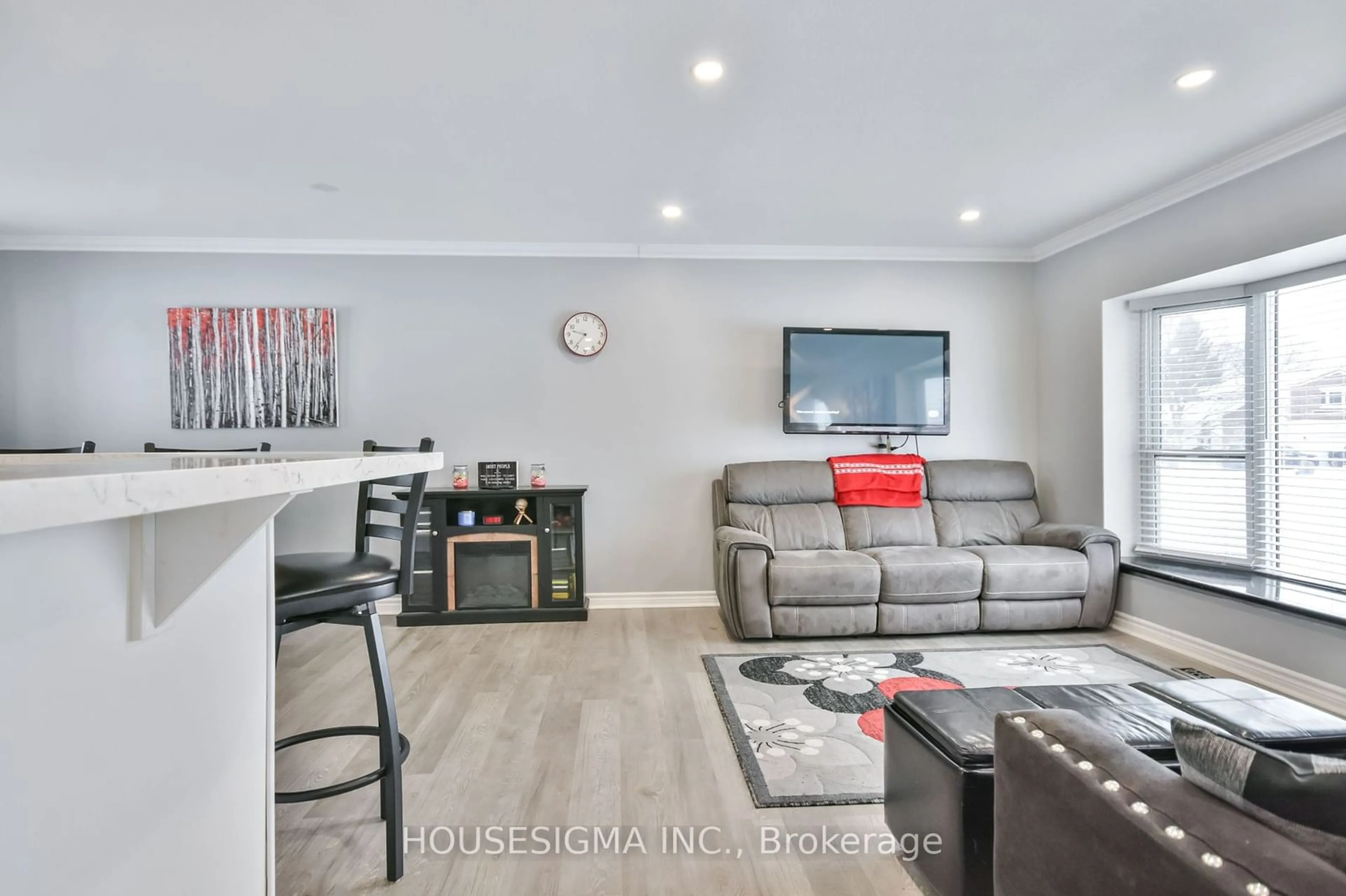 Living room with furniture, wood/laminate floor for 229 Sunset Cres, Innisfil Ontario L9S 1J2