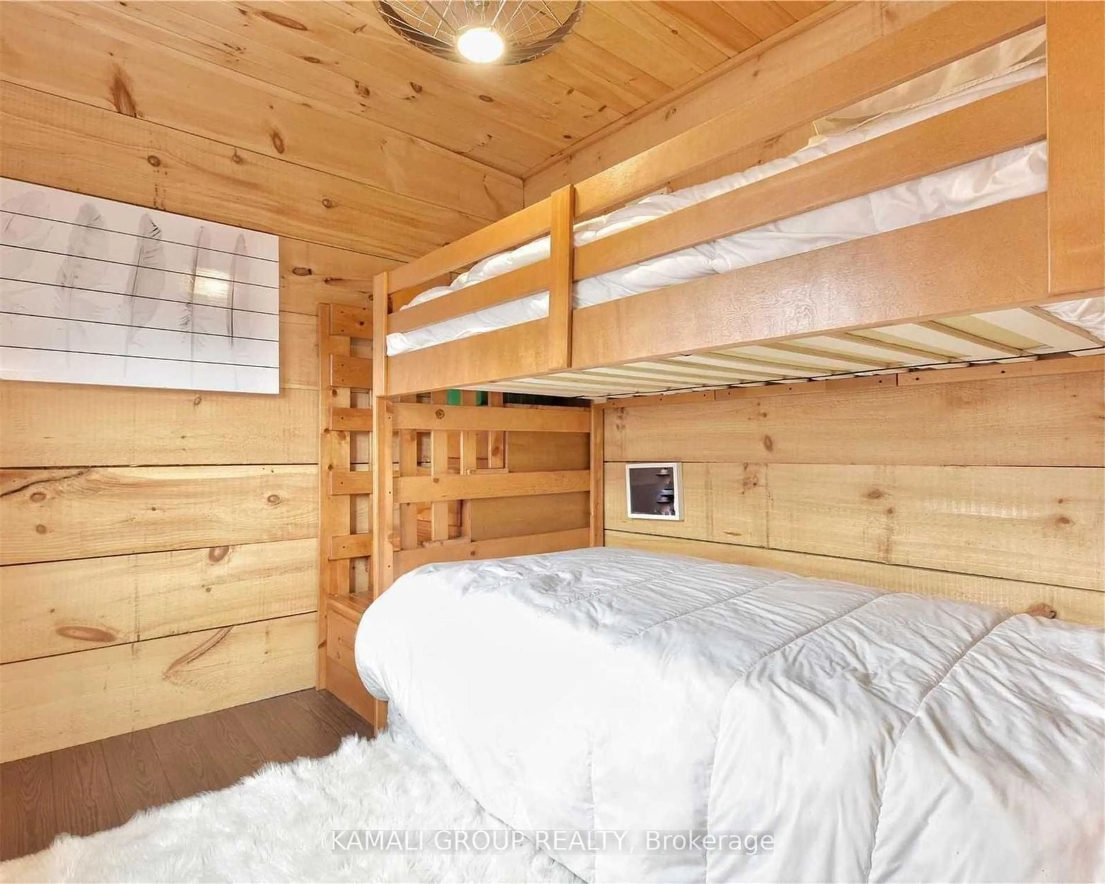 Bedroom with bed, wood/laminate floor for 219 Holmes Point Rd, Georgina Ontario K7V 3Z9