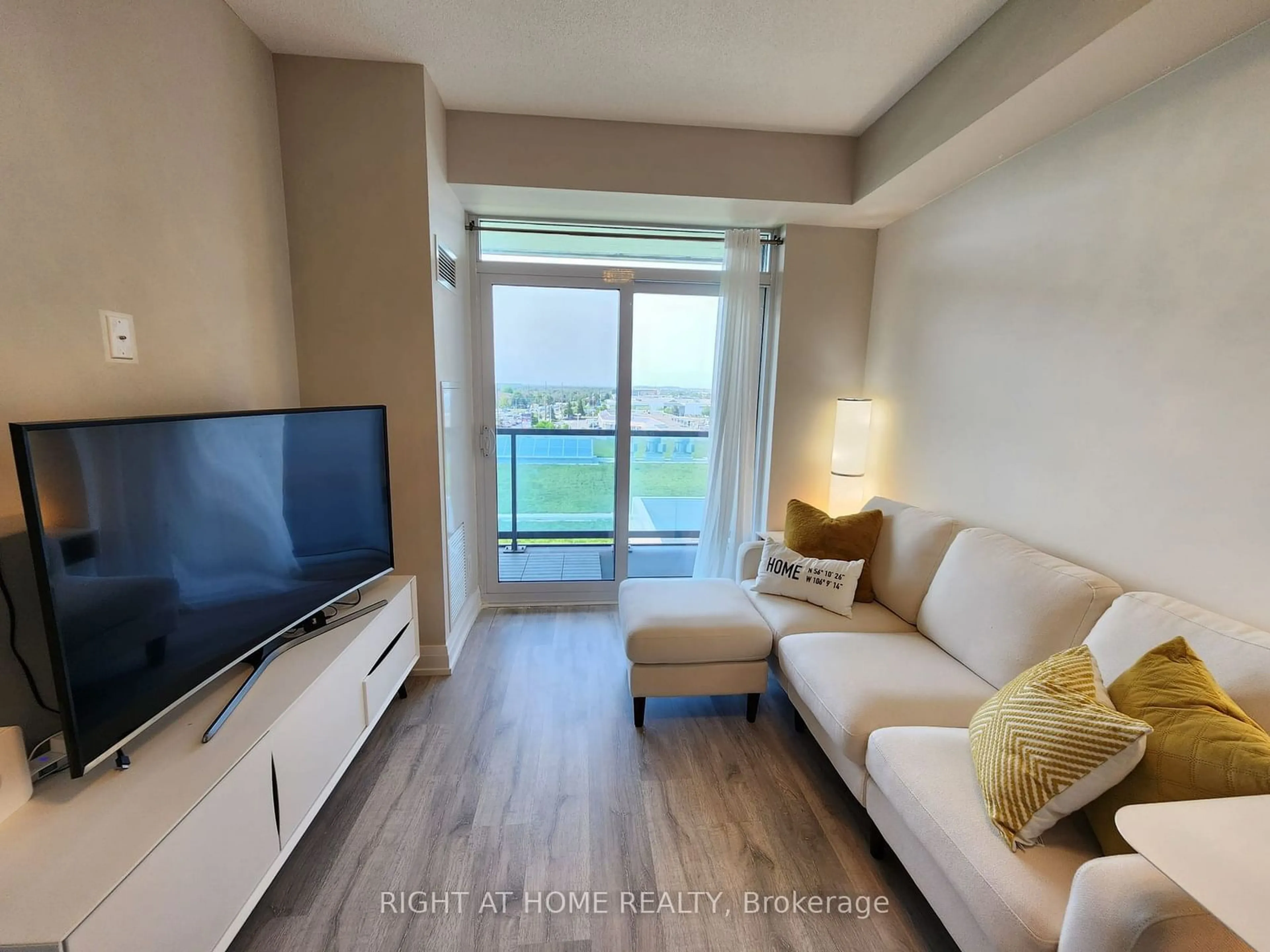 Living room with furniture, wood/laminate floor for 3700 Highway 7 Rd #510, Vaughan Ontario L4L 0G8