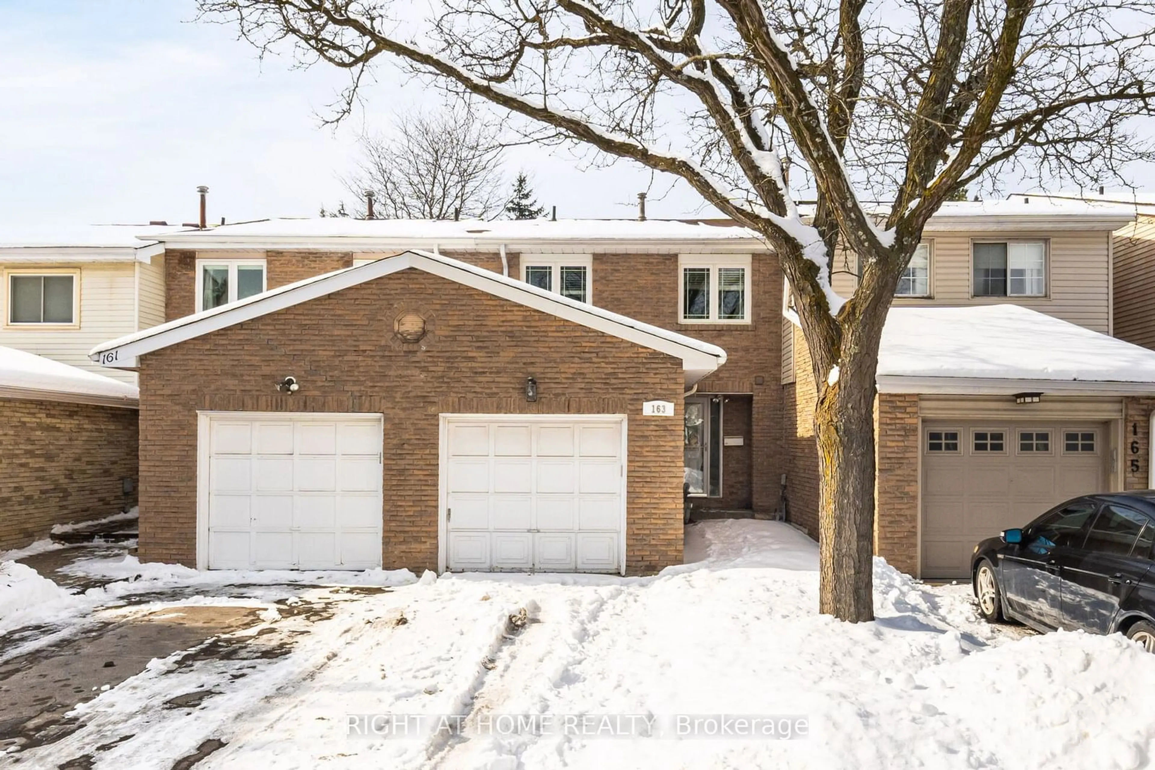 Home with brick exterior material, street for 163 Tamarack Dr, Markham Ontario L3T 4X3