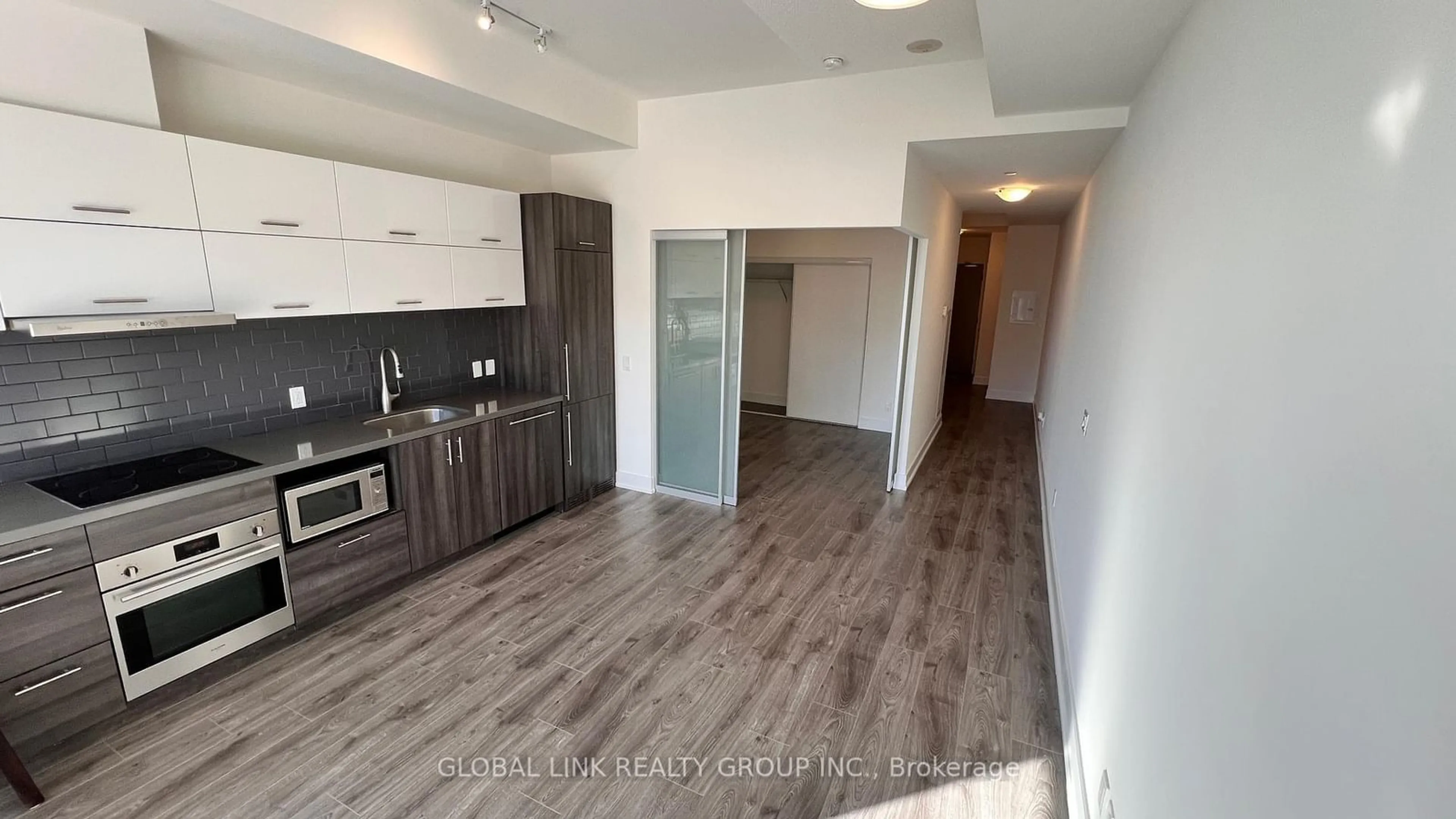 Open concept kitchen, wood/laminate floor for 180 enterprise Blvd #303, Markham Ontario L6G 0G4