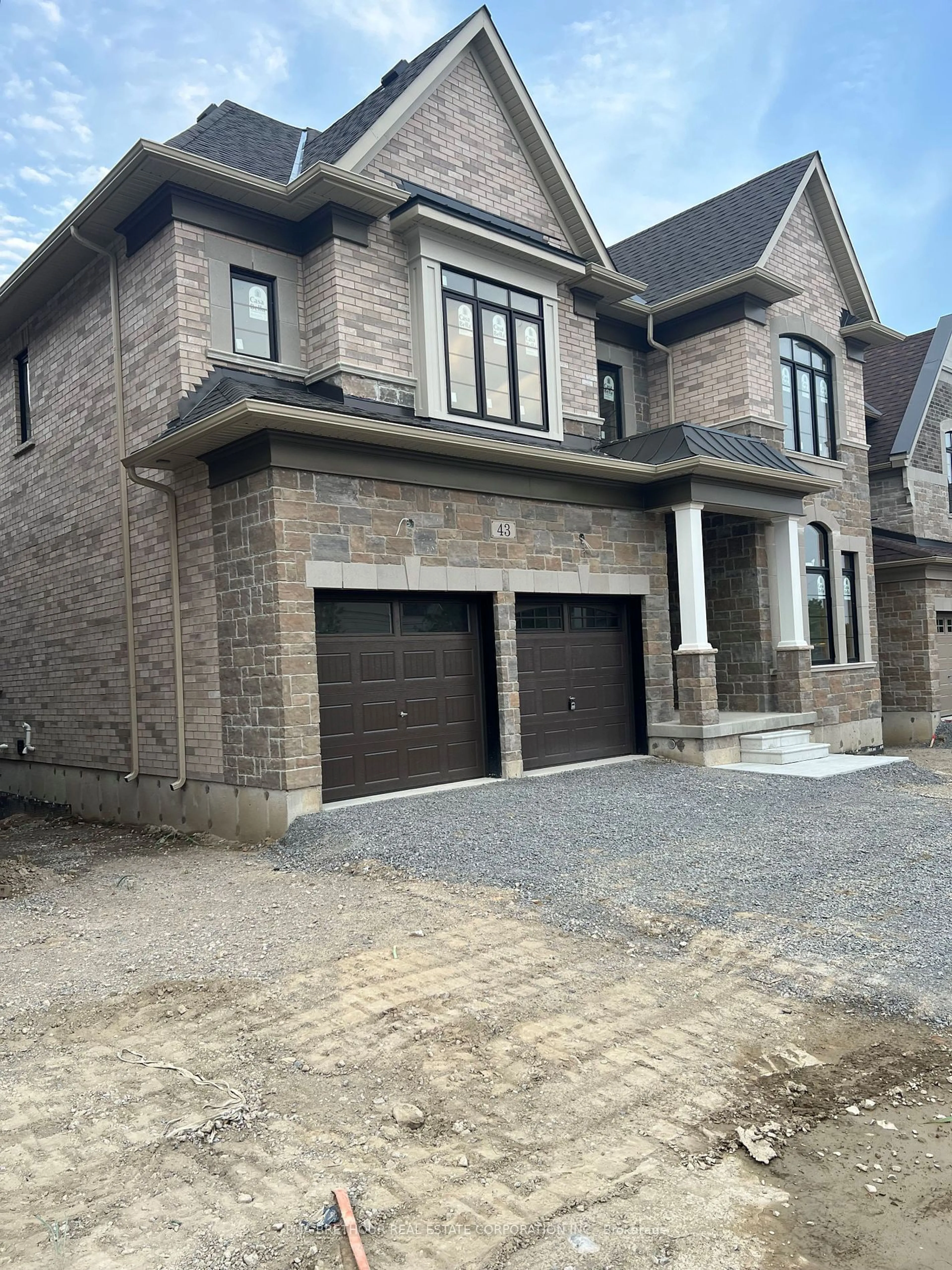 Home with brick exterior material, street for 43 Bush Ridge Ave, Richmond Hill Ontario L4E 0P1