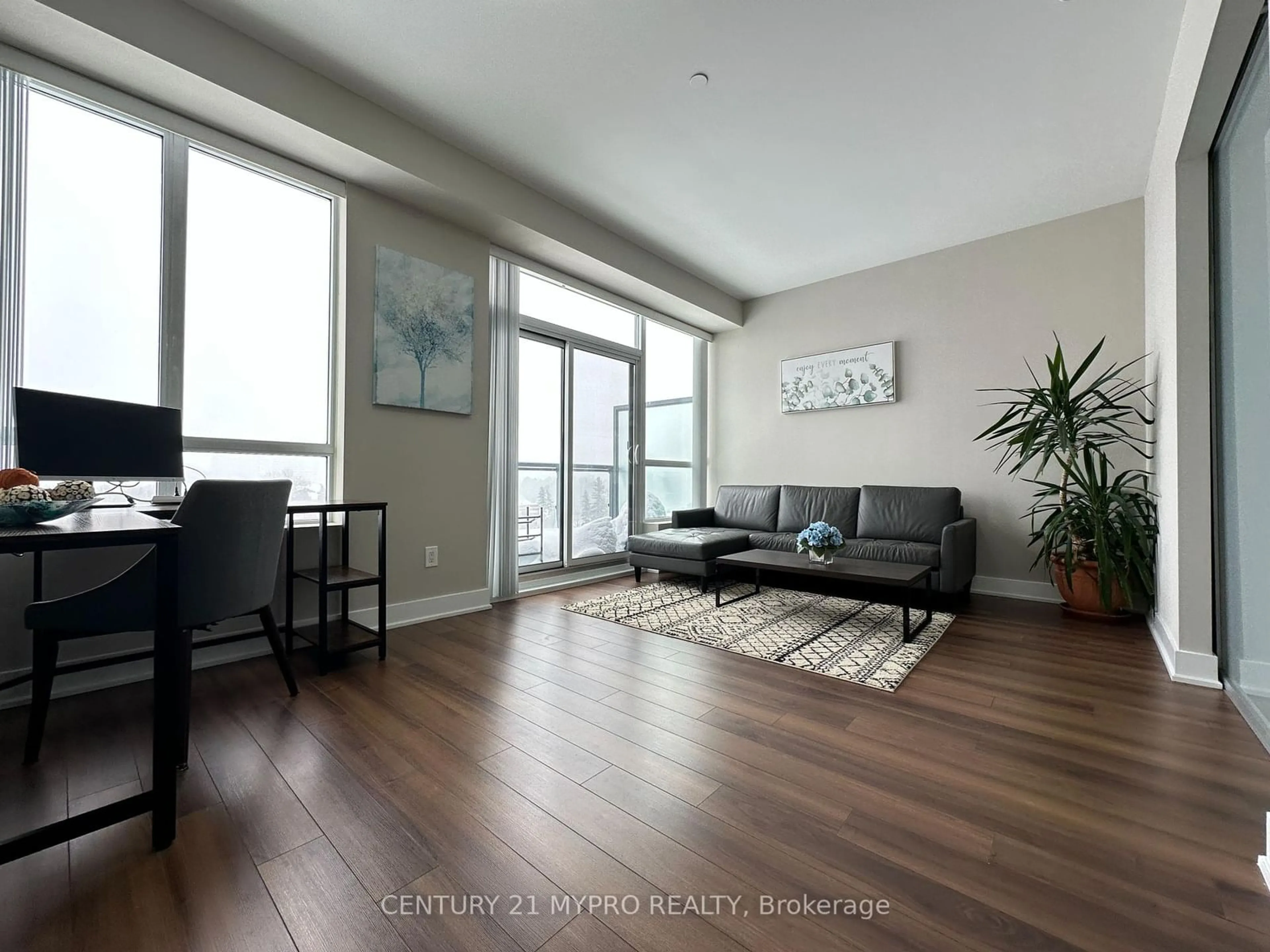 Living room with furniture, wood/laminate floor for 7608 Yonge St #PH18, Vaughan Ontario L4J 0J5