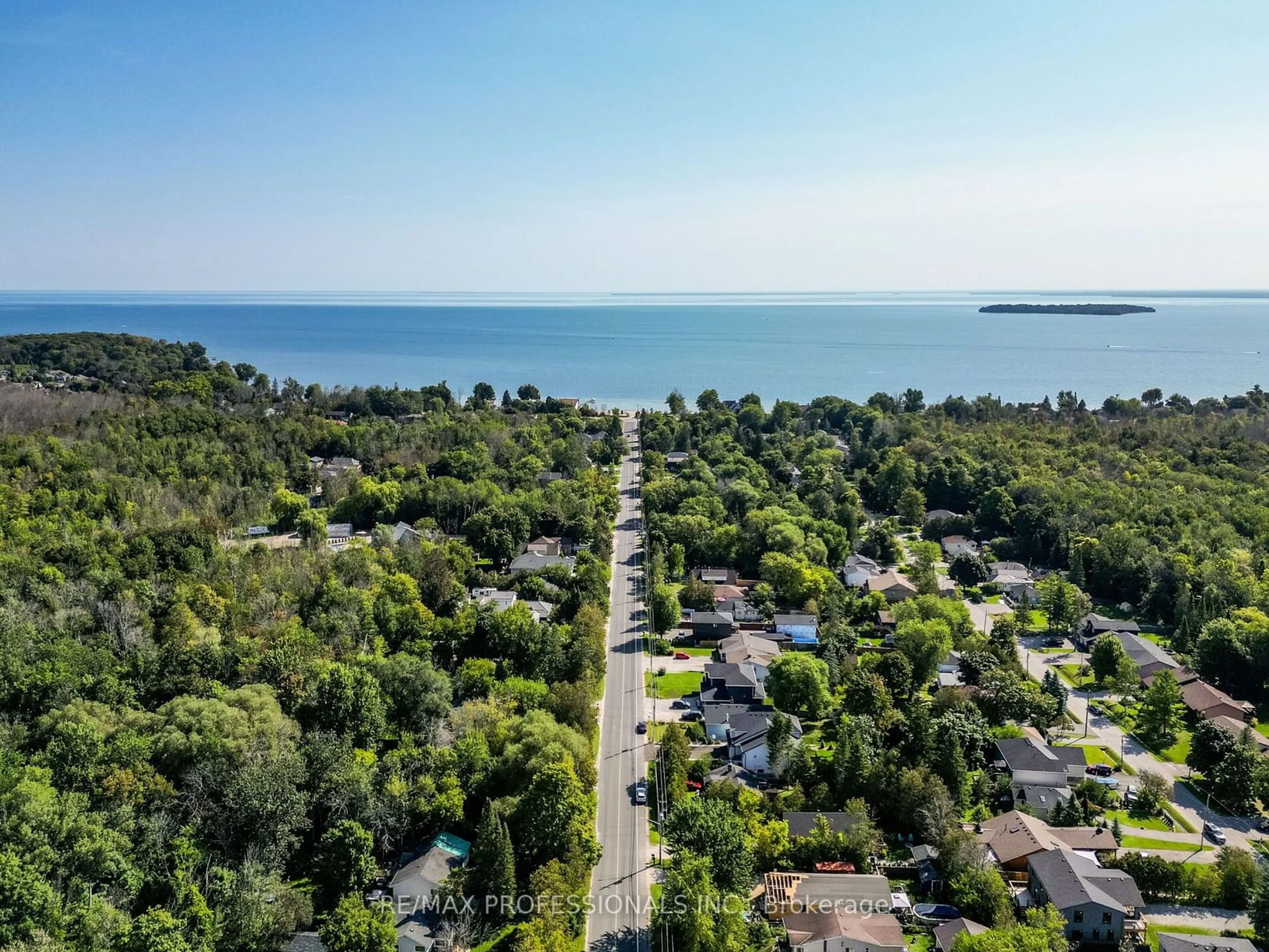 A pic from outside/outdoor area/front of a property/back of a property/a pic from drone, water/lake/river/ocean view for 757 10th Line, Innisfil Ontario L9S 3N3