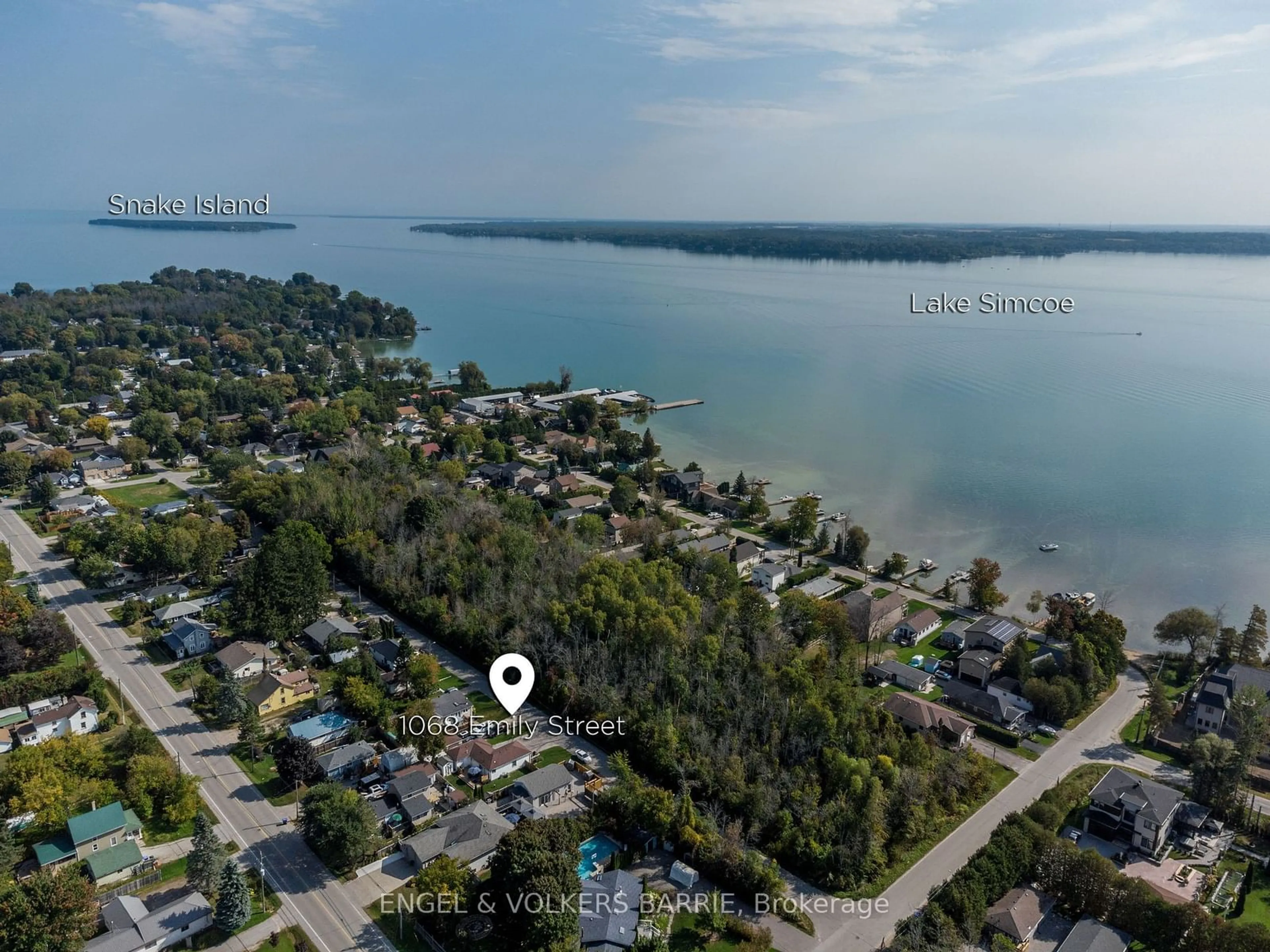 A pic from outside/outdoor area/front of a property/back of a property/a pic from drone, water/lake/river/ocean view for 1068 Emily St, Innisfil Ontario L0L 1C0