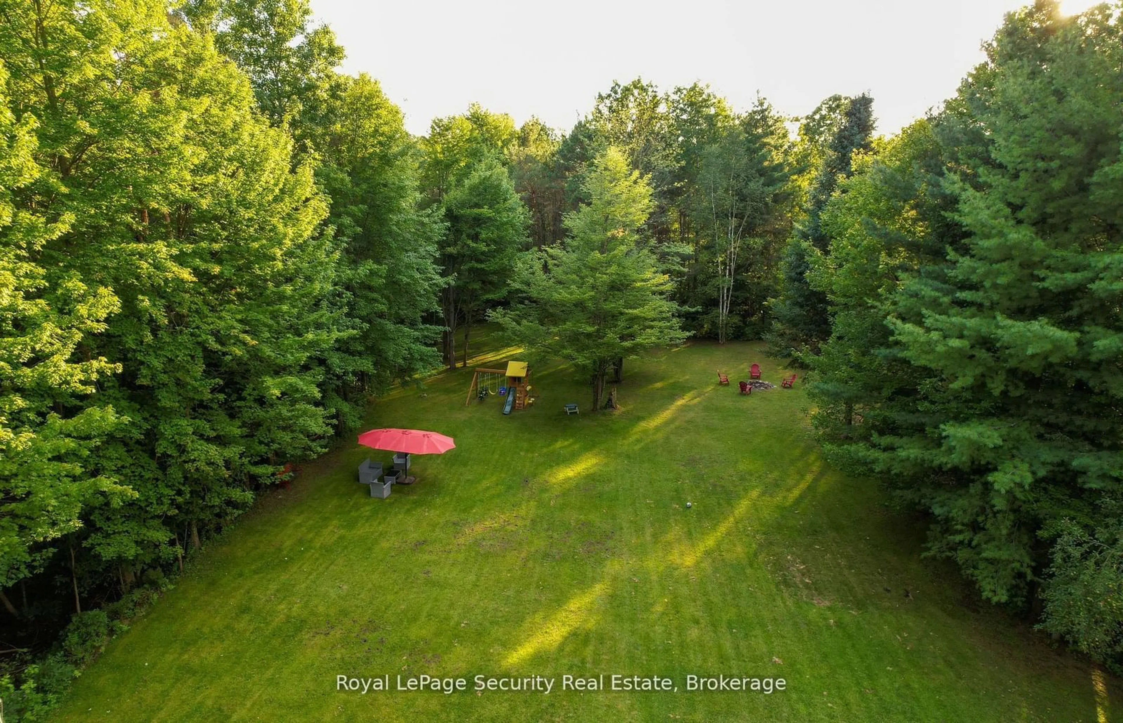 A pic from outside/outdoor area/front of a property/back of a property/a pic from drone, forest/trees view for 7458 5th Line, Essa Ontario L0M 1B1