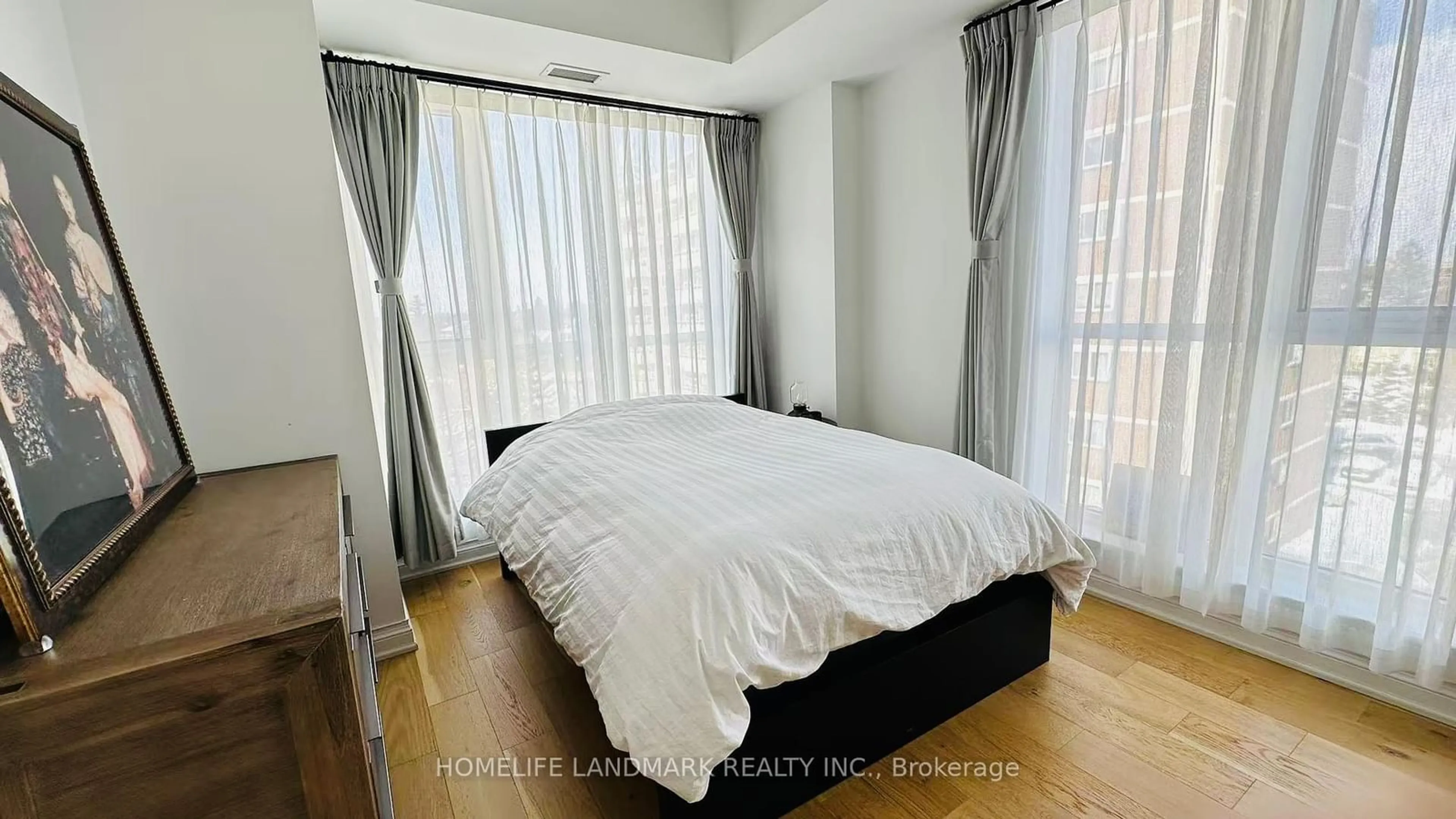 Bedroom with bed, wood/laminate floor for 68 Main St #501, Markham Ontario L3P 0N5