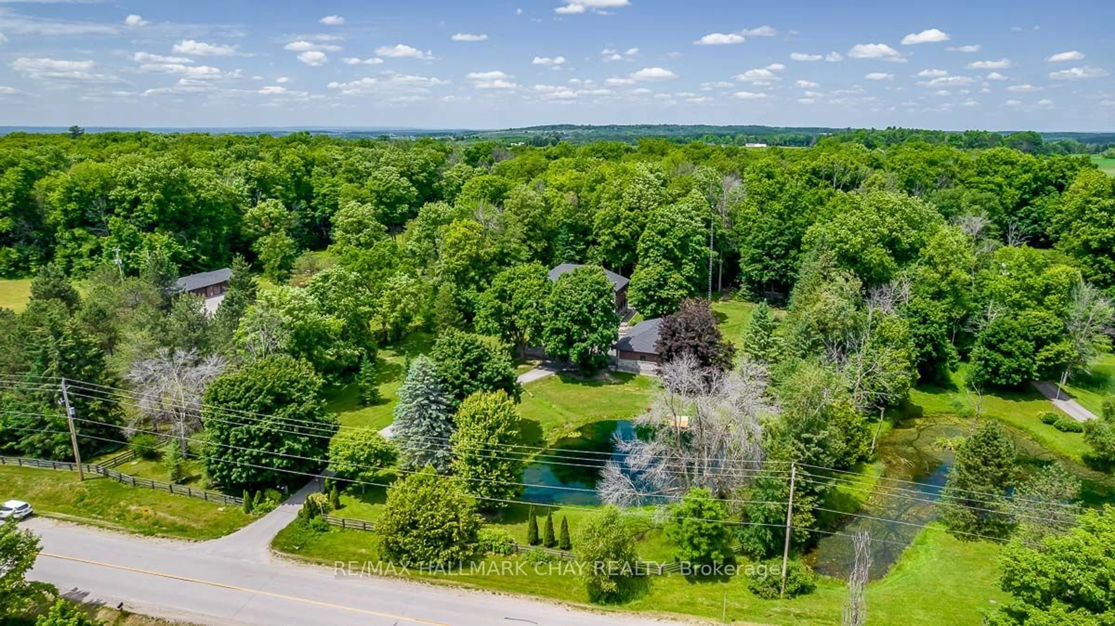 A pic from outside/outdoor area/front of a property/back of a property/a pic from drone, water/lake/river/ocean view for 5834 2nd Line, New Tecumseth Ontario L0G 1T0