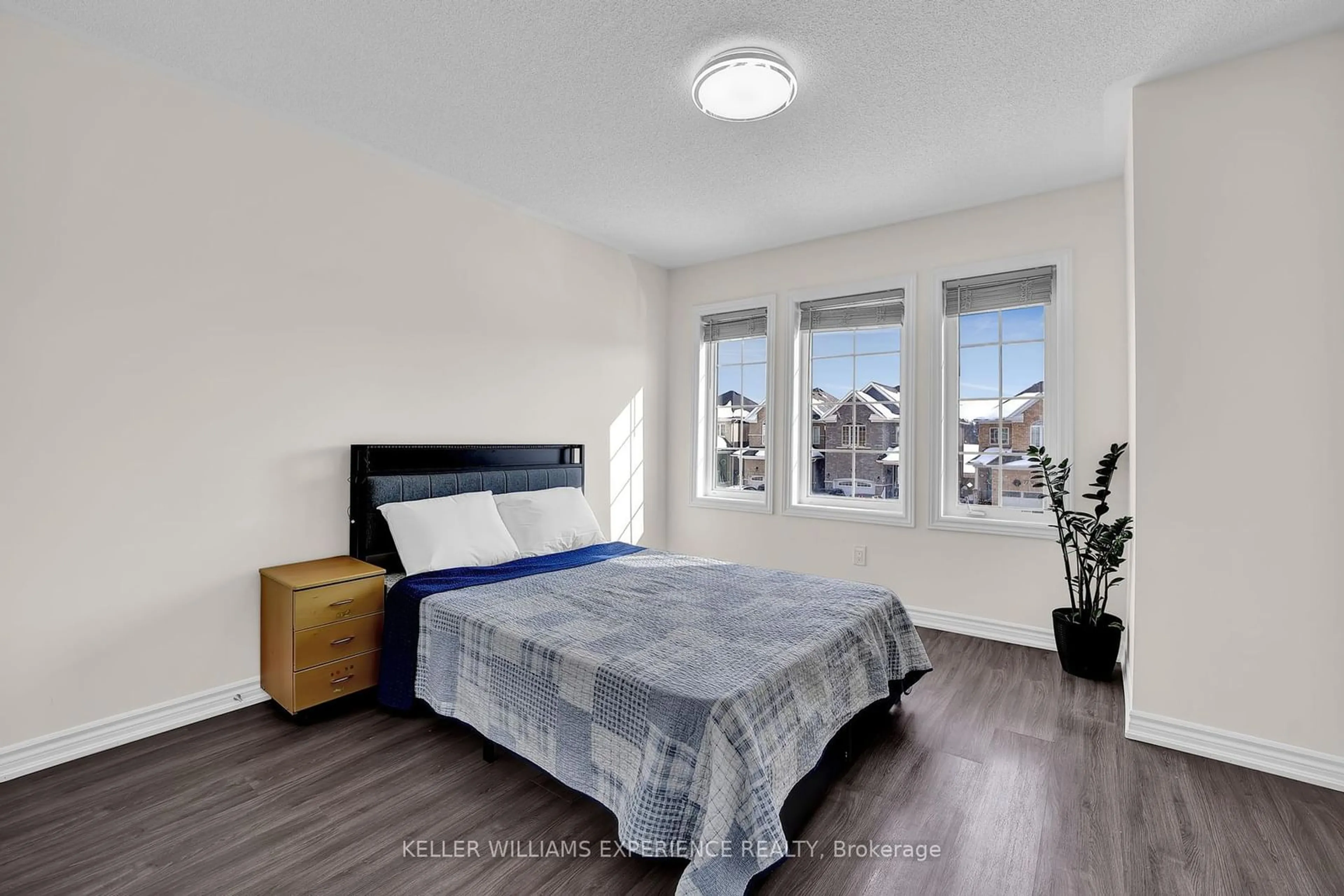 Bedroom with bed, wood/laminate floor for 78 Wagner Cres, Essa Ontario L3W 0R6